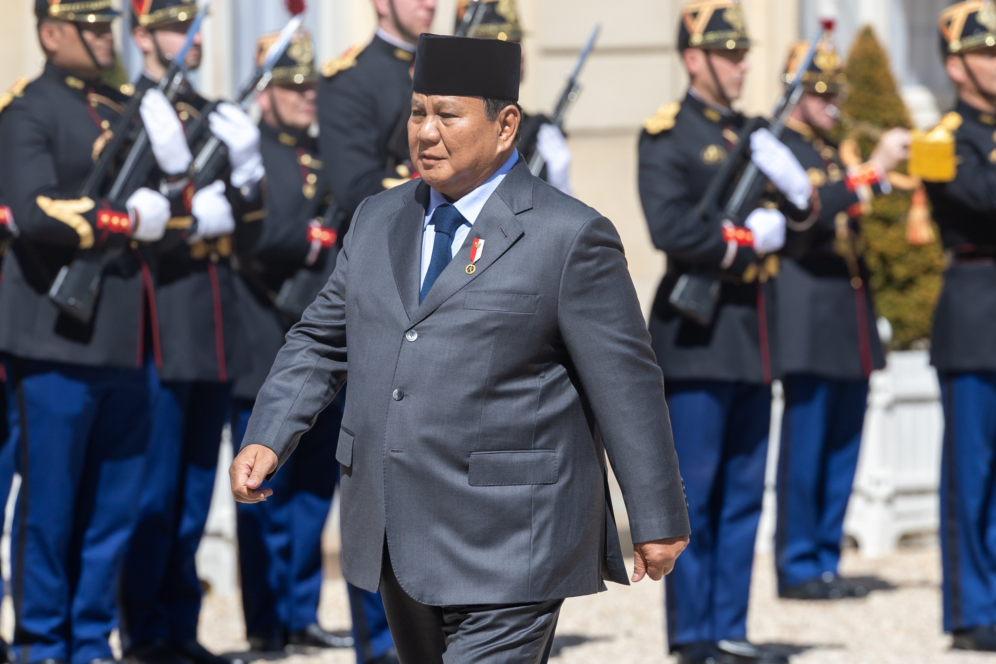 Indonesian President Prabowo Subianto inspects the French Republican Guard upon arrival at the Elysee Palace in Paris on Tuesday. Photo: EPA