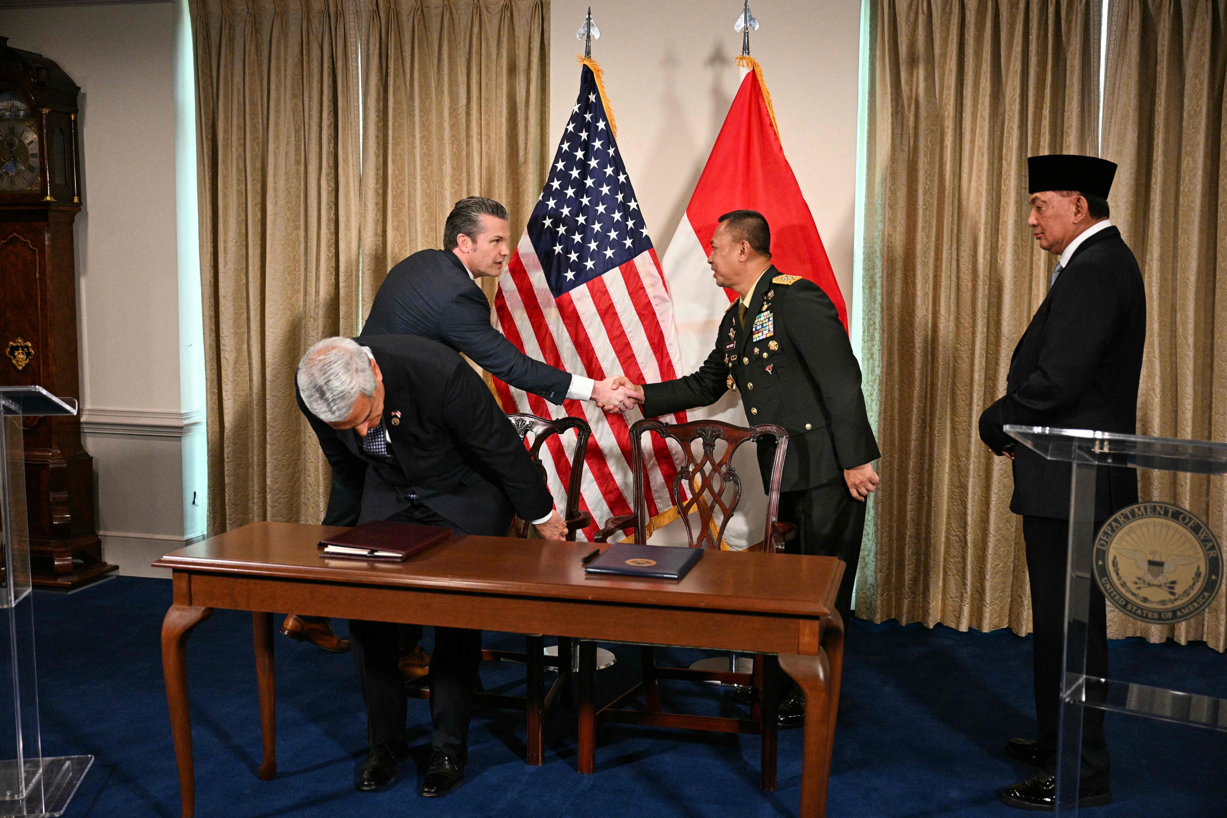 US Defence Secretary Pete Hegseth shakes hands with Indonesia’s Director General of Defence Strategy Major General Agus Widodo at the Pentagon on Monday. Photo: AFP