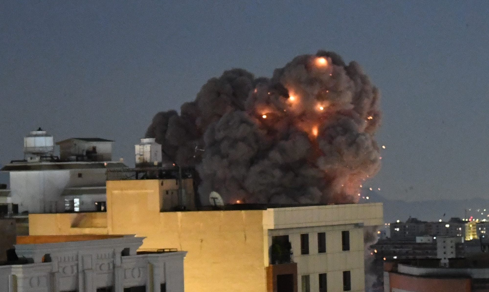 A plume of smoke rises from buildings after an explosion in Tehran last month. Photo: Xinhua