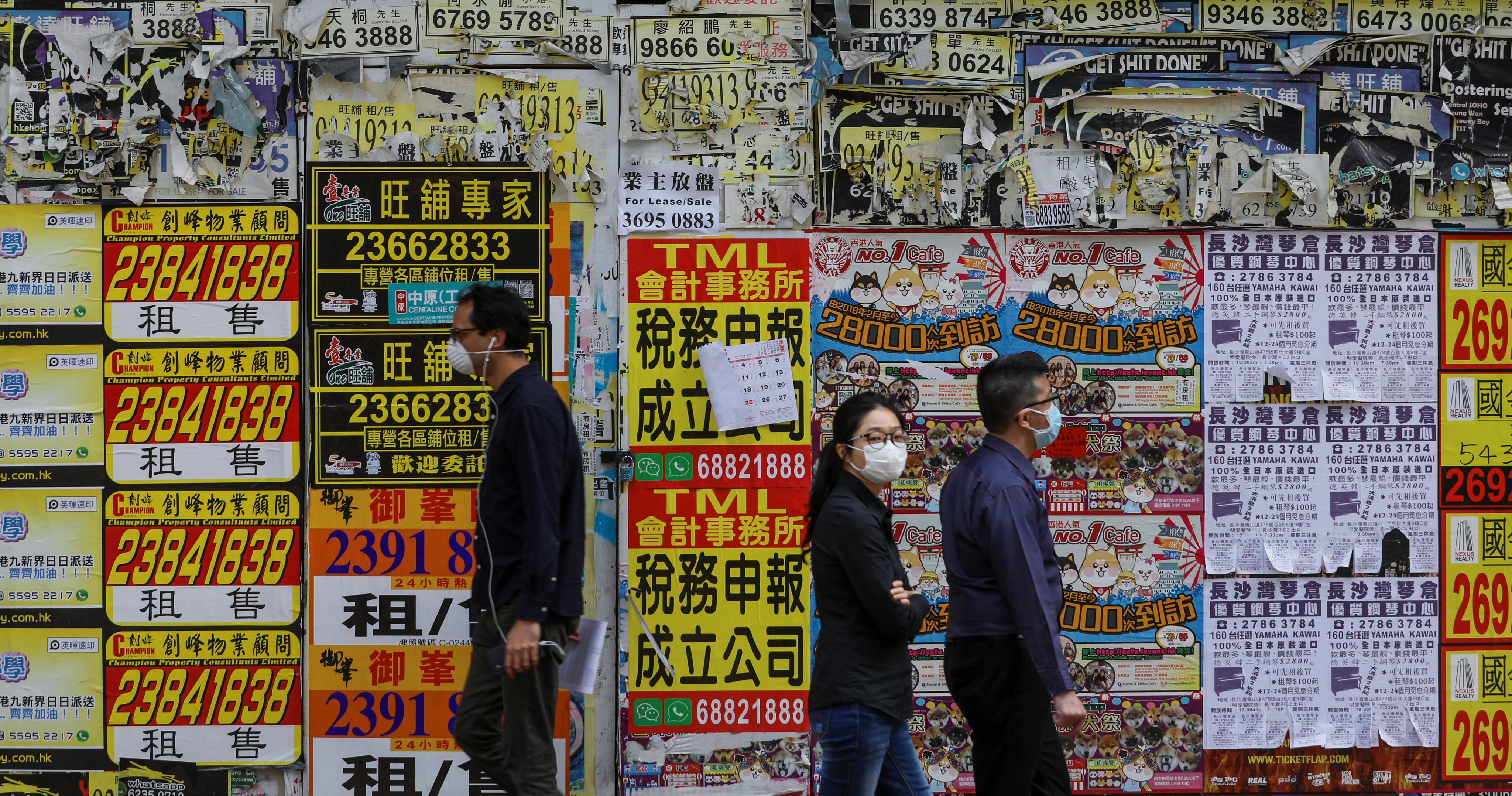 People walk past a closed shop in Causeway Bay on March 16, 2020. Photo: Sam Tsang