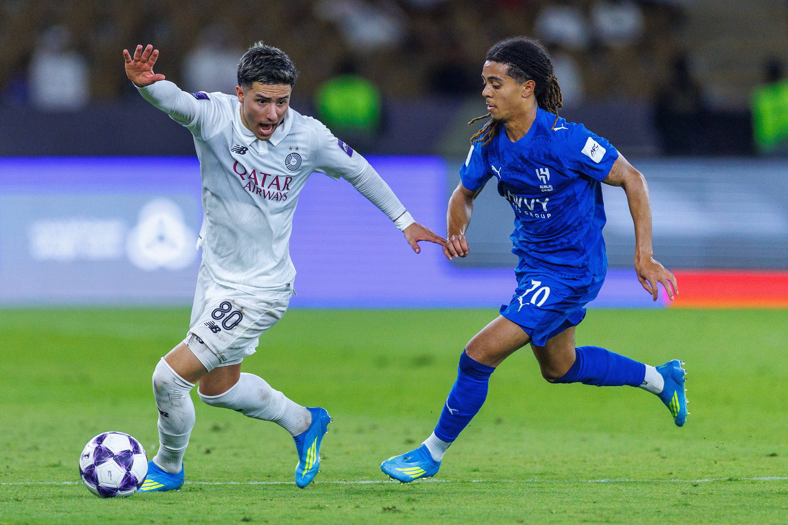 Agustin Soria of Al-Sadd (left) is challenged by Al-Hilal’s Saimon Bouabre during their Champions League Elite match in Jeddah, Saudi Arabia on Monday. Photo: Getty Images