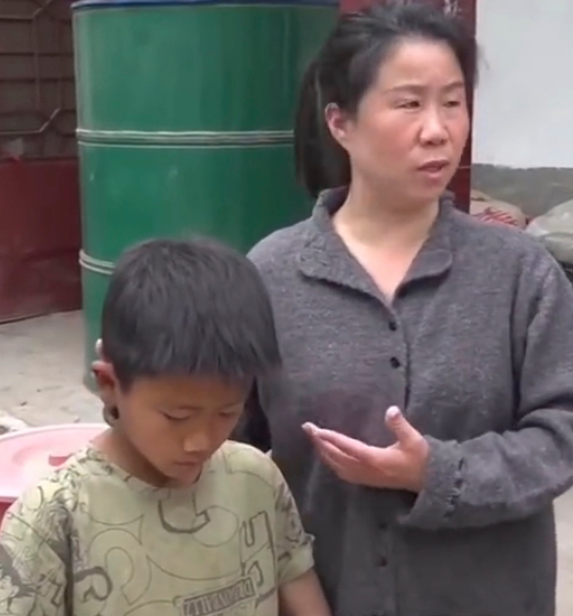 Zichen with the teacher who has pledged to look after him should anything happen to his grandfather. Photo: Weibo