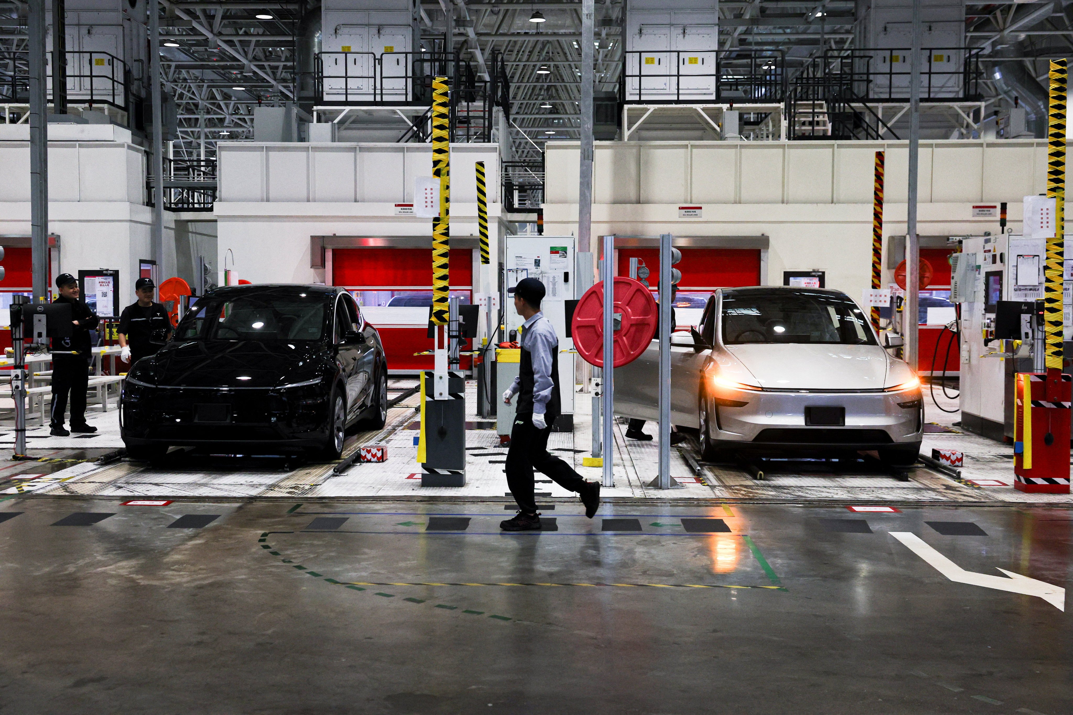 Employees work inside the Tesla Gigafactory in Shanghai during a government-organised media tour, April 14, 2026. Photo: Reuters