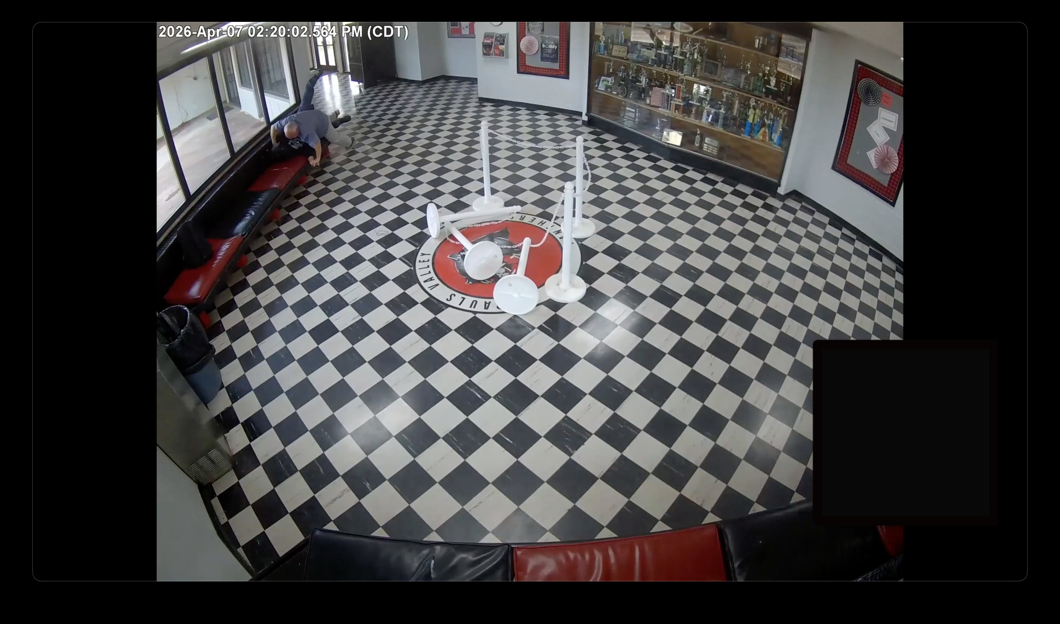 Principal Kirk Moore can be seen struggling with Victor Hawkins, a former student who allegedly carried a firearm onto the campus in Pauls Valley, Oklahoma, on April 7. Photo: Pauls Valley Public Schools via AP