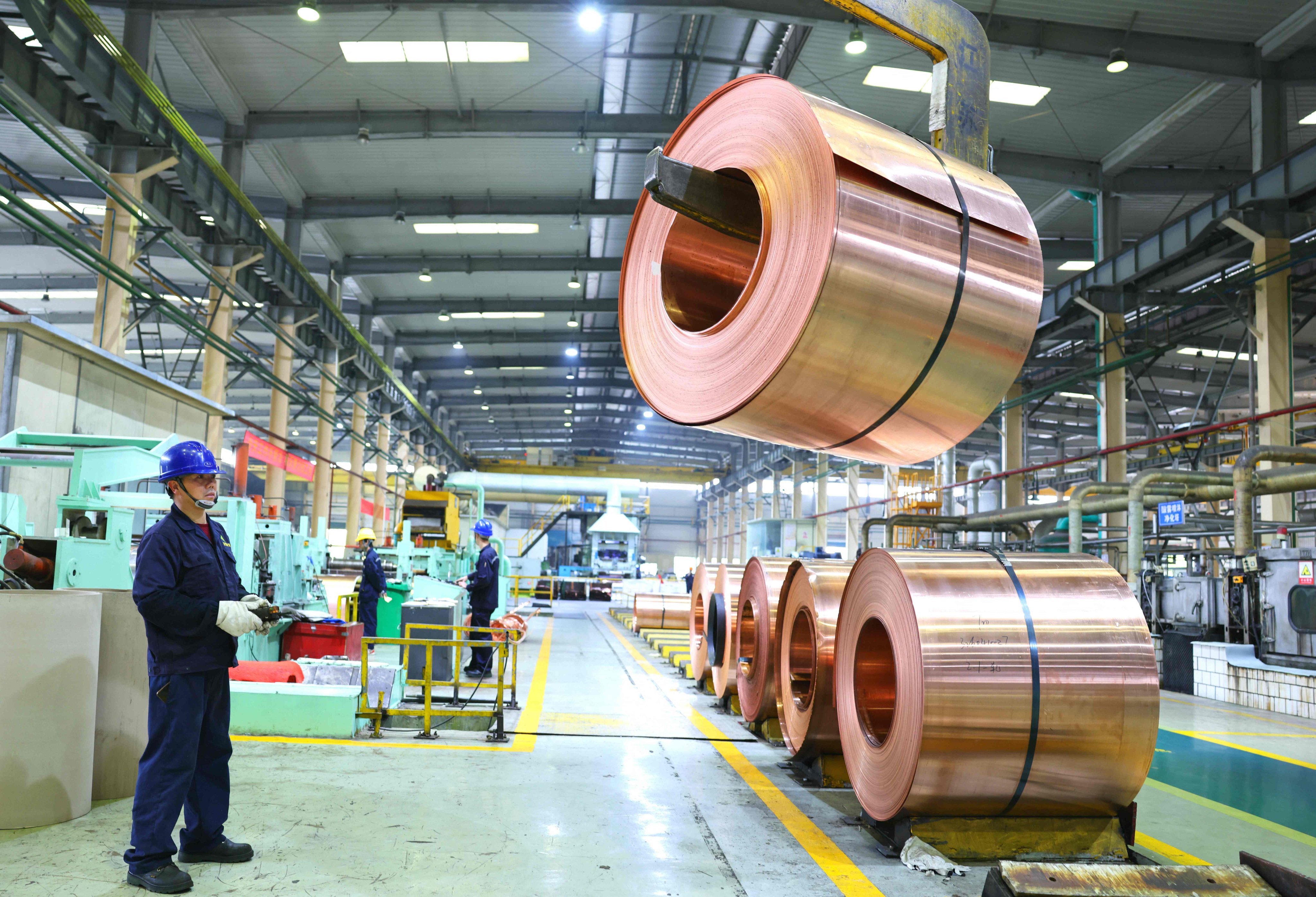 A coil of copper is moved at an electrical materials factory in Dongyang, Zhejiang province, on Tuesday. Photo: AFP