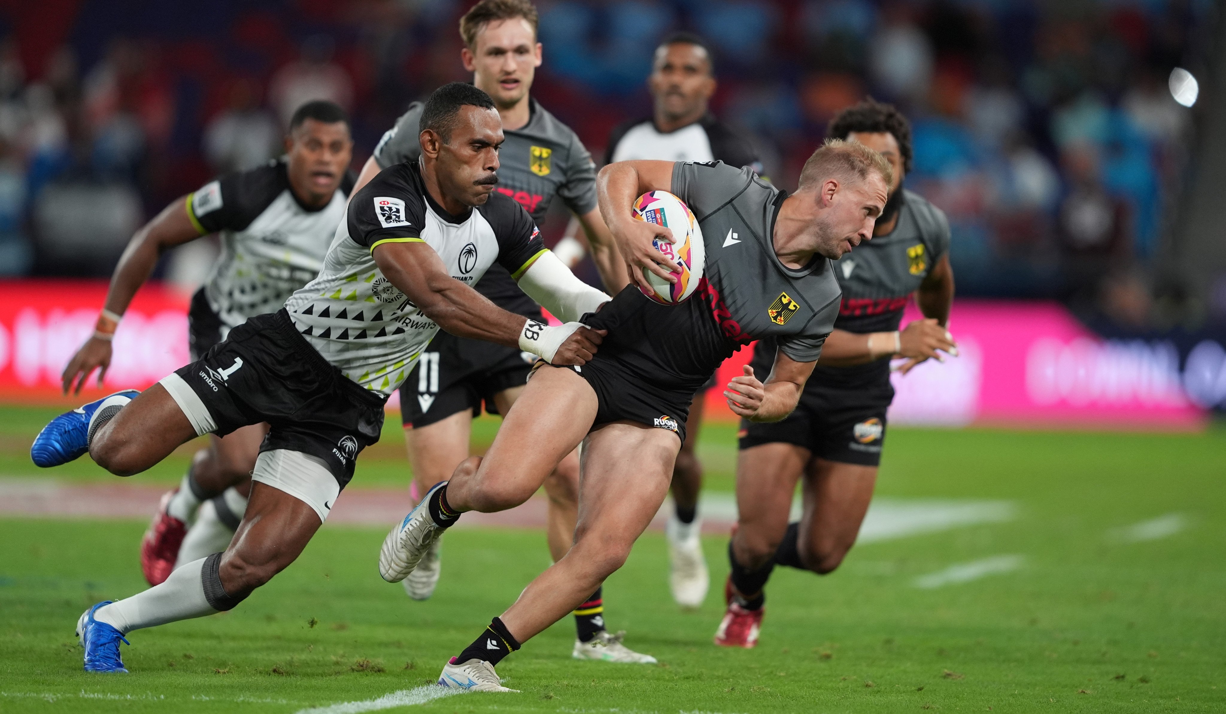Niklas Koch tries to wriggle clear of Fiji’s Kavekini Tanivanuakula during Germany’s opening Cathay/HSBC Sevens clash. Photo: Elson Li