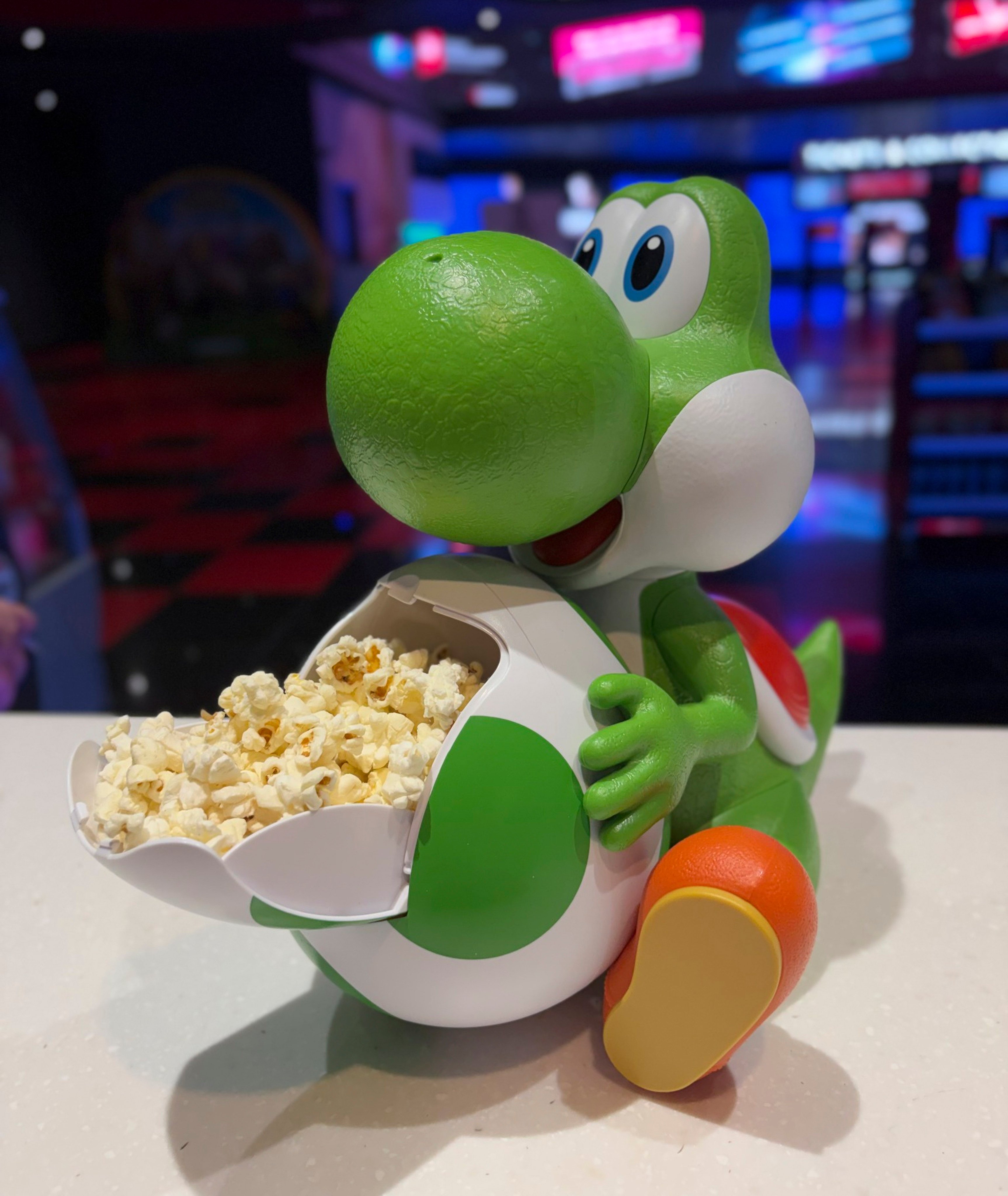 A Yoshi popcorn bucket is seen at Cineworld Wandsworth in London, England. Cinema operators are betting on increasingly elaborate popcorn buckets to capitalise on millennial nostalgia, drum up excitement for films and ultimately increase profits. Photo: courtesy of Cineworld Wandsworth
