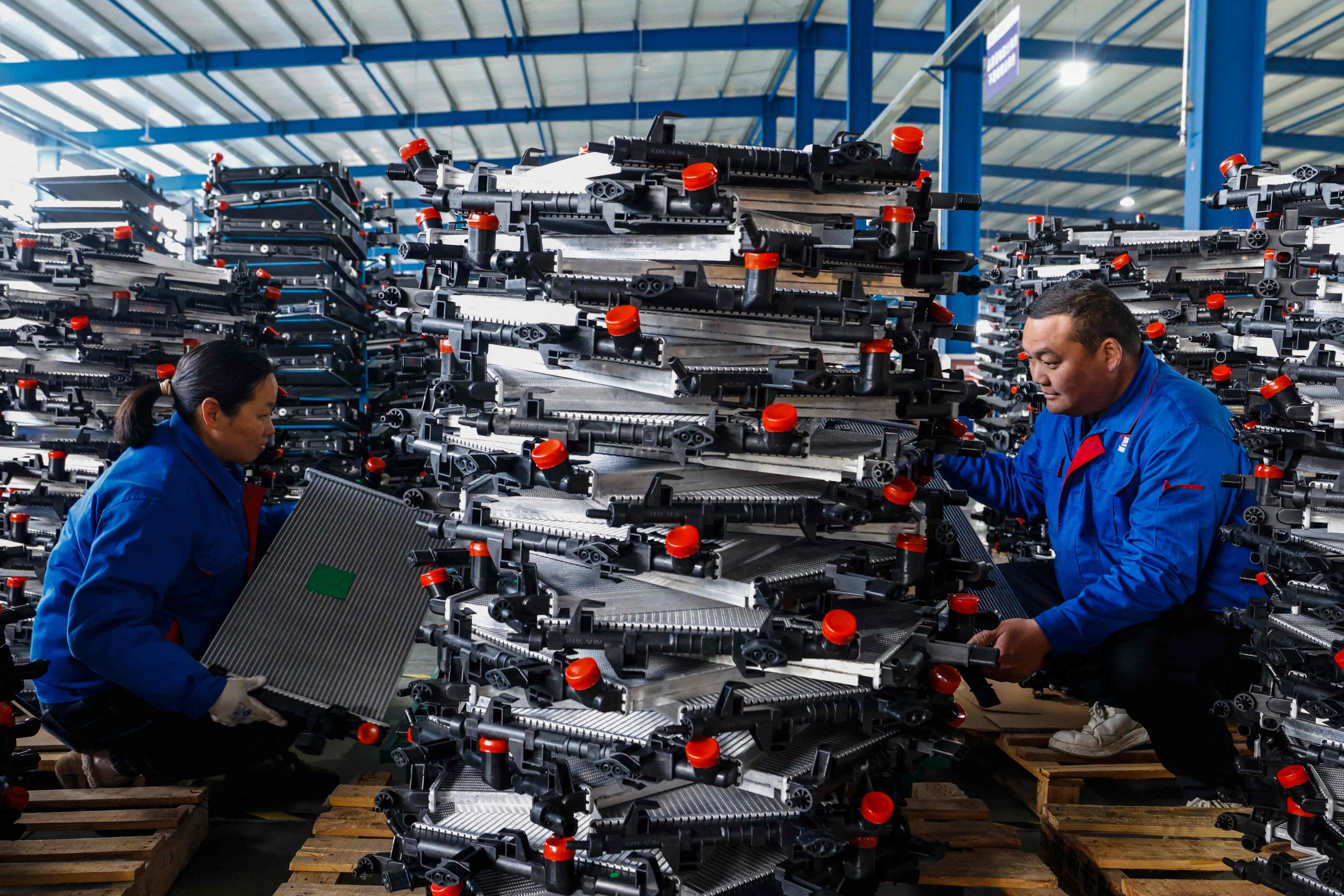 Workers at an auto parts factory in Sihong, in eastern China’s Jiangsu province, on March 3. Photo: AFP