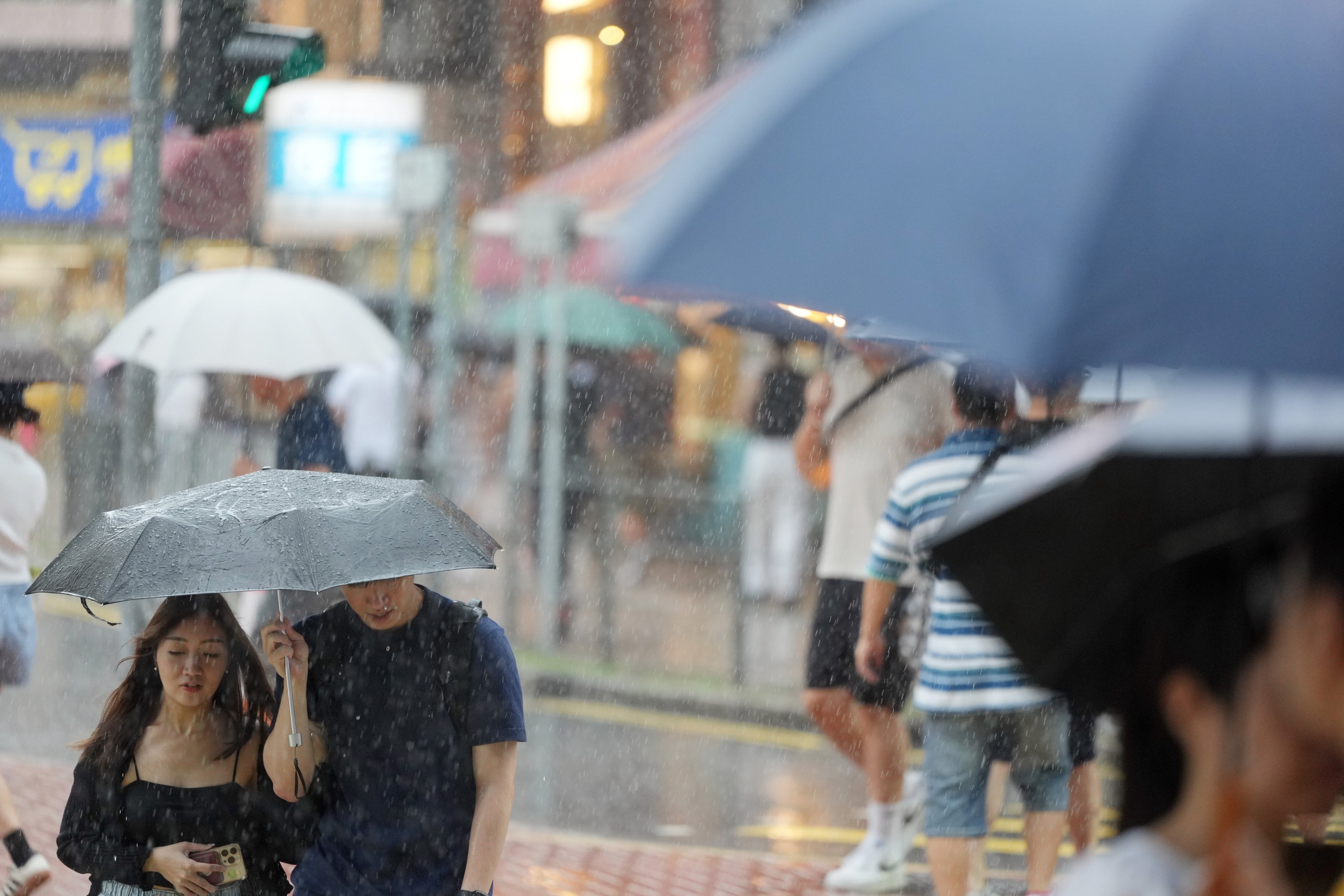 Residents brave the heavy rain in Tai Wai last September. Photo: Sam Tsang