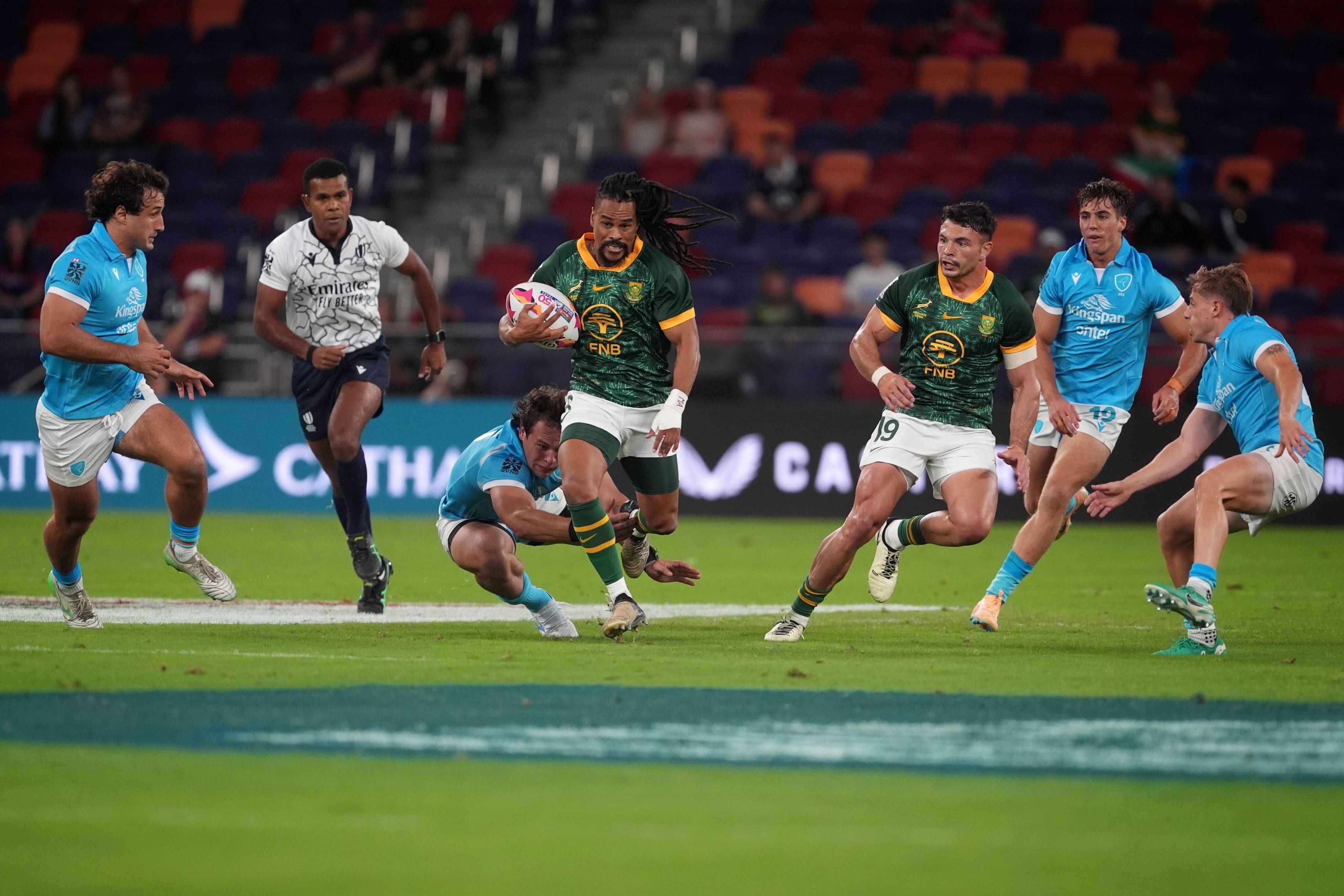South Africa’s Selvyn Davids races clear to score against Uruguay in the Cathay/HSBC Hong Kong Sevens. Photo: Elson Li
