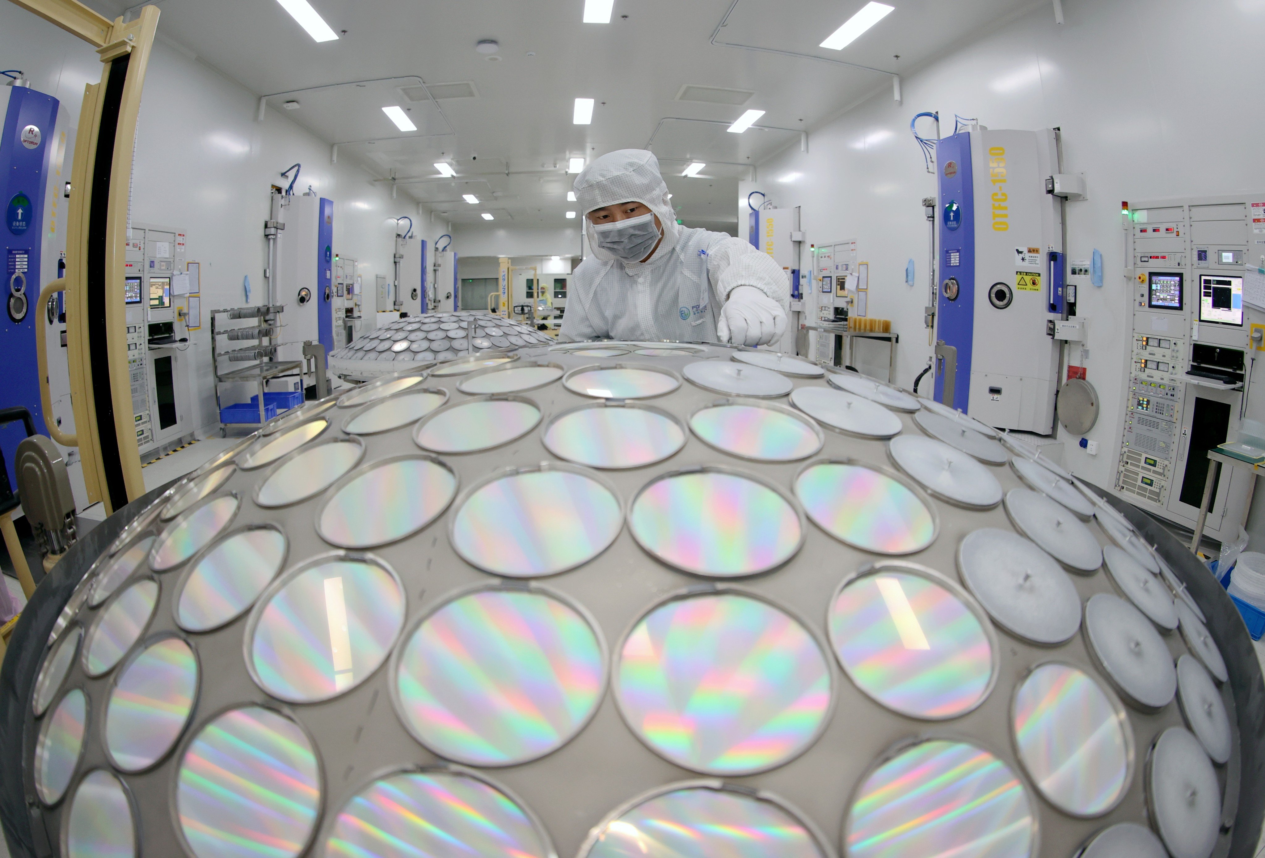 A worker produces LED chips on a production line in China’s Jiangsu province. Photo: Getty Images
