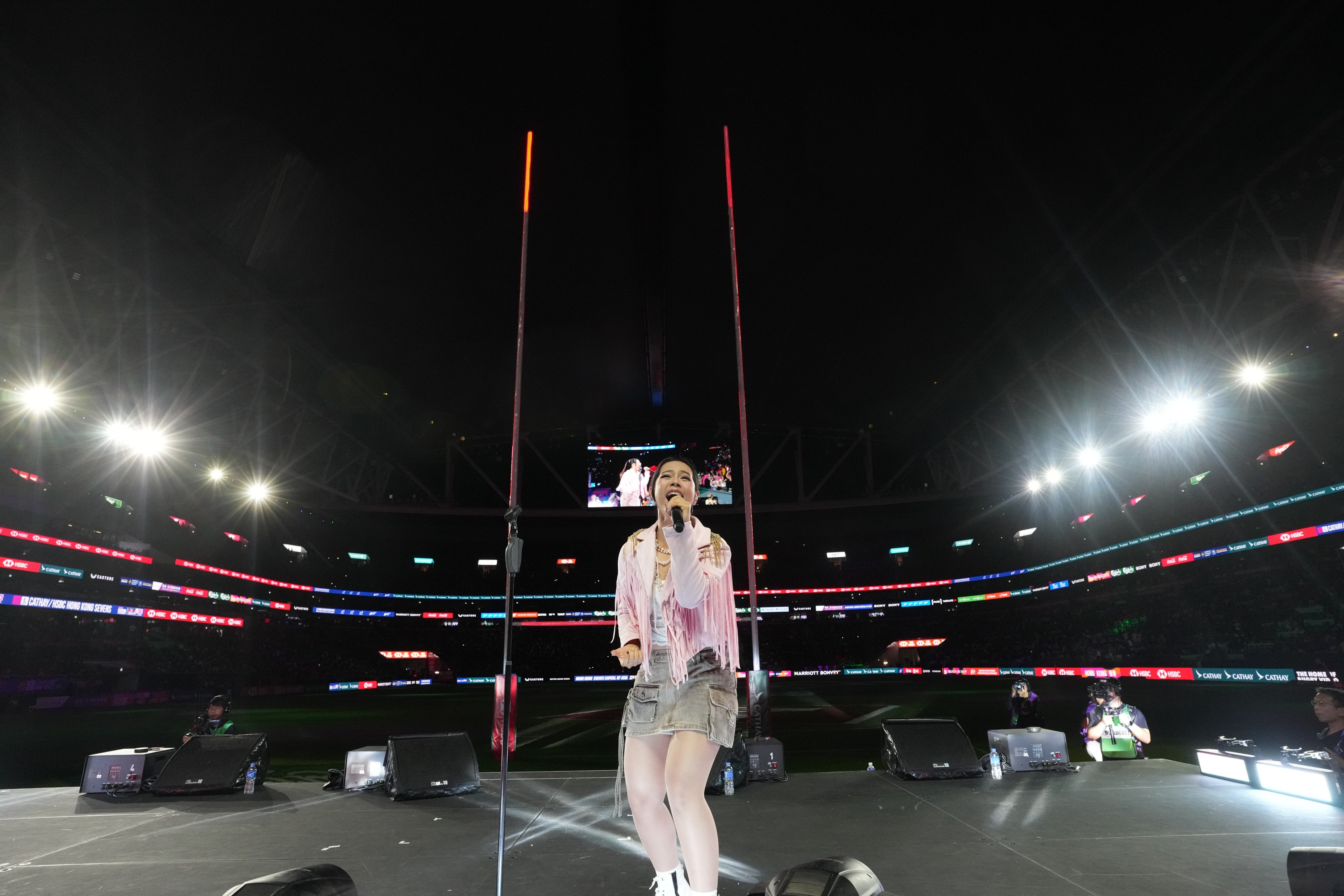 Singer Gwyn Dorado performs in front of the South Stand as part of the opening ceremony for the Cathay/HSBC Hong Kong Sevens. Photo: Elson Li