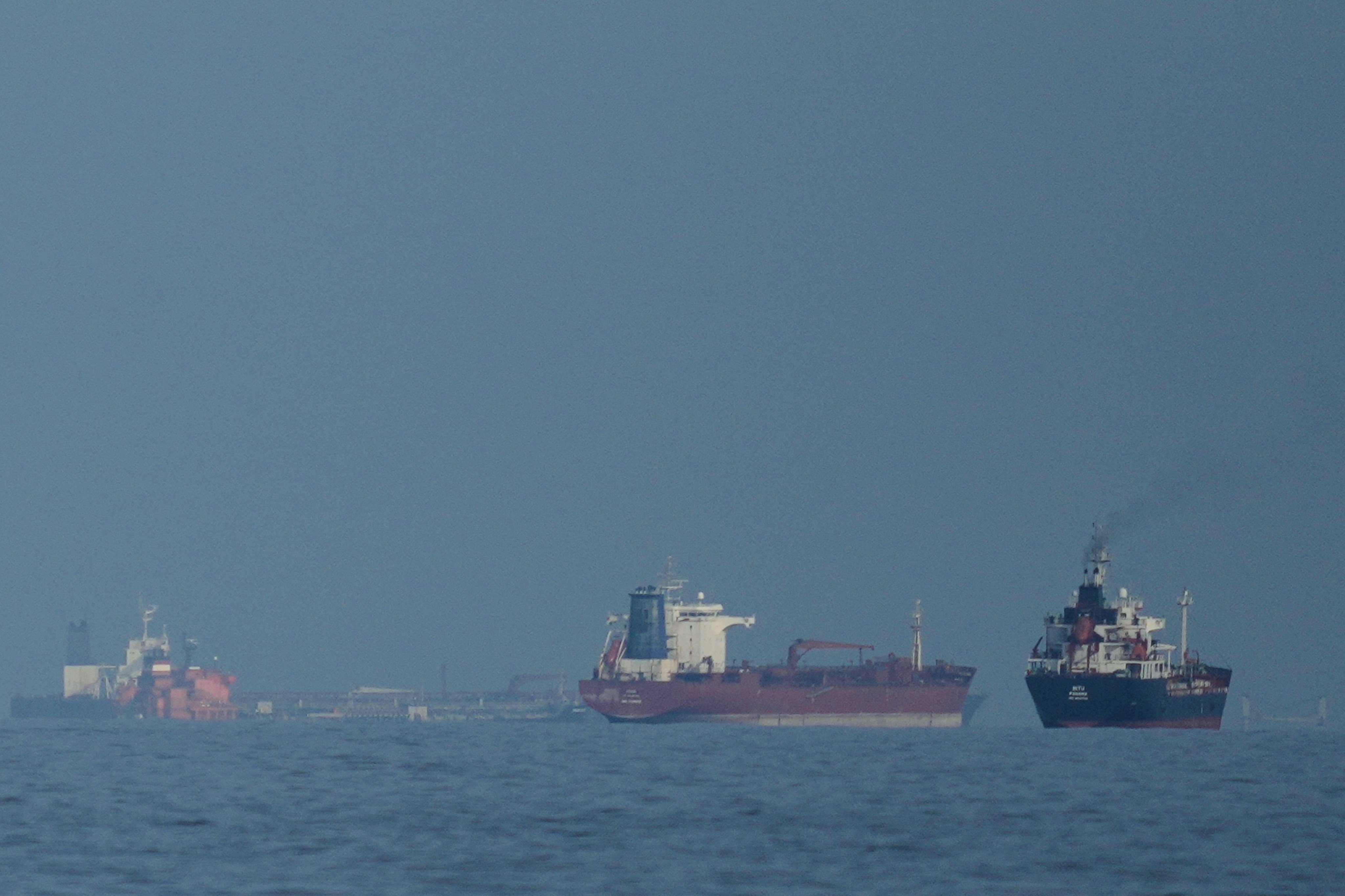 Oil tankers and cargo ships line up in the Strait of Hormuz as seen from Khor Fakkan, the United Arab Emirates, last month. Photo: AP