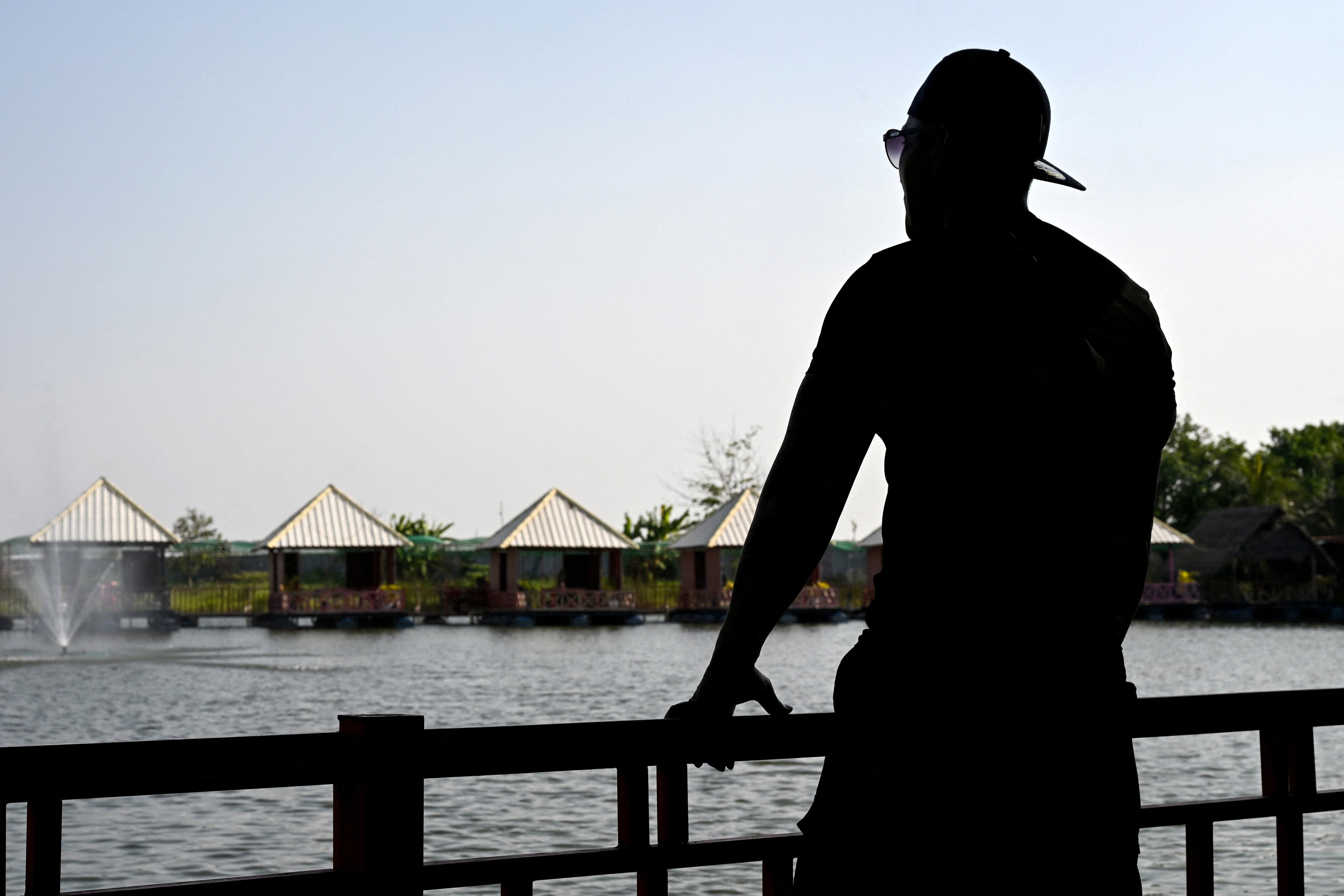 Cambodian Pheap Rom poses for picture at a restaurant in Phnom Penh on March 30, 2026. A Cambodian refugee long-settled in the United States, ex-convict Pheap Rom, remains bewildered at how he wound up behind bars in the African nation of Eswatini for months after being swept up in Donald Trump’s deportation blitz. (Photo by TANG CHHIN Sothy / AFP) / To go with ‘Cambodia-Eswatini-US-Migrants-Rights-Crime’ Focus by Suy Se and Matt Surrusco