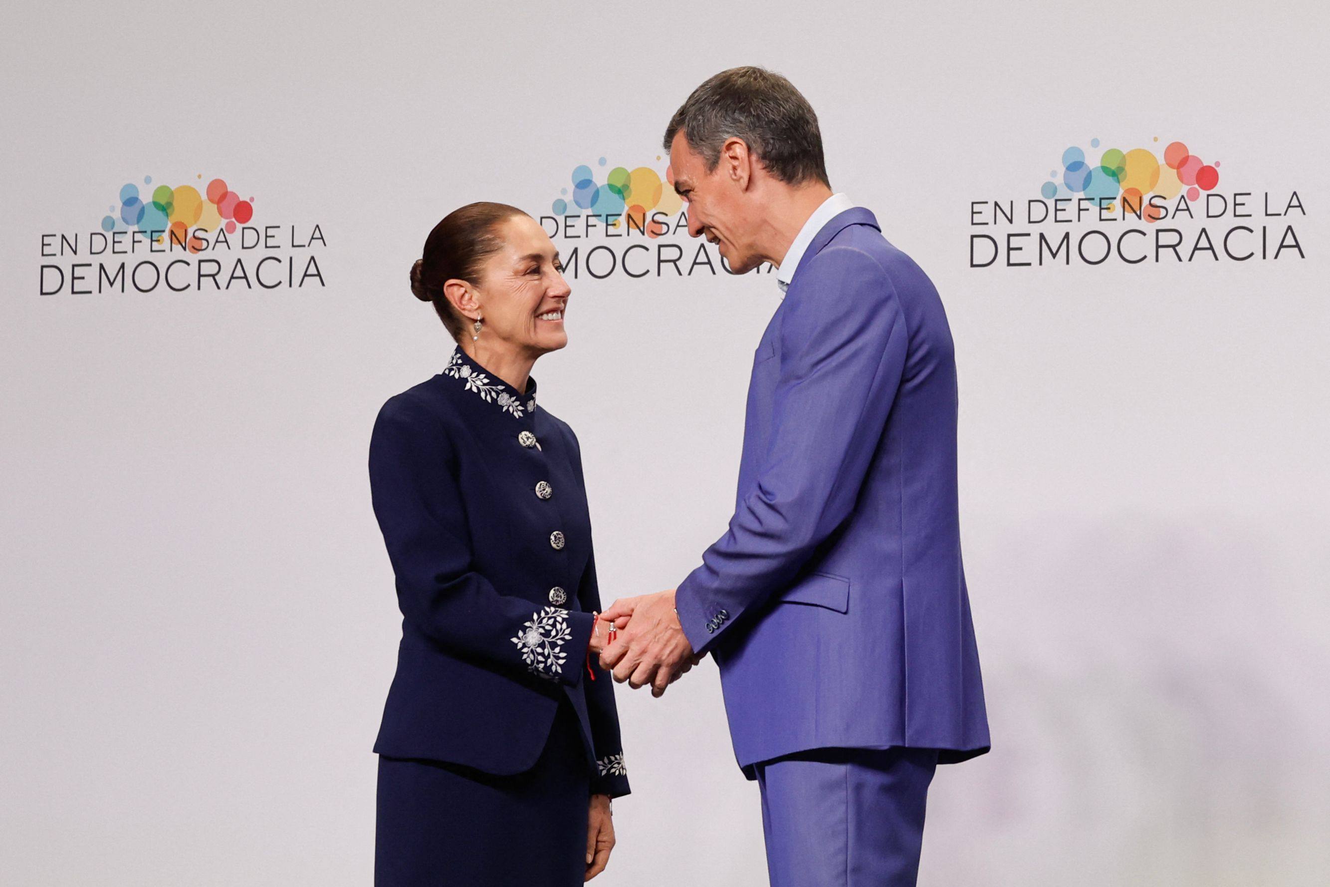 Mexico’s President Claudia Sheinbaum (left) greets Spain’s Prime Minister Pedro Sanchez at the “Meeting in Defence of Democracy” in Barcelona on Saturday. Photo: AFP