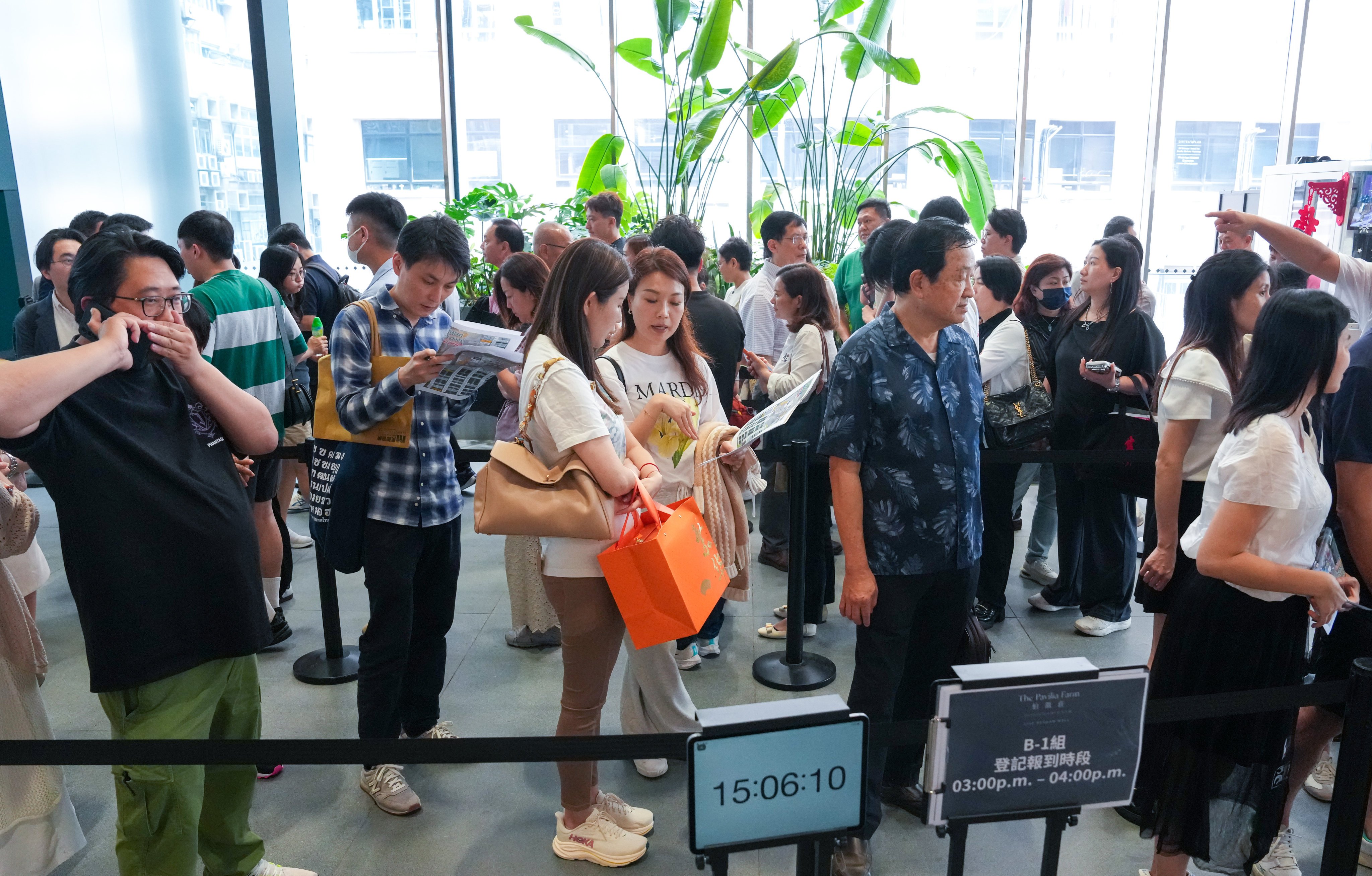 Prospective buyers queue at the Lai Chi Kok sales office of The Pavilia Farm III to secure flats at the Tai Wai Station development on Saturday. Photo: Jelly Tse