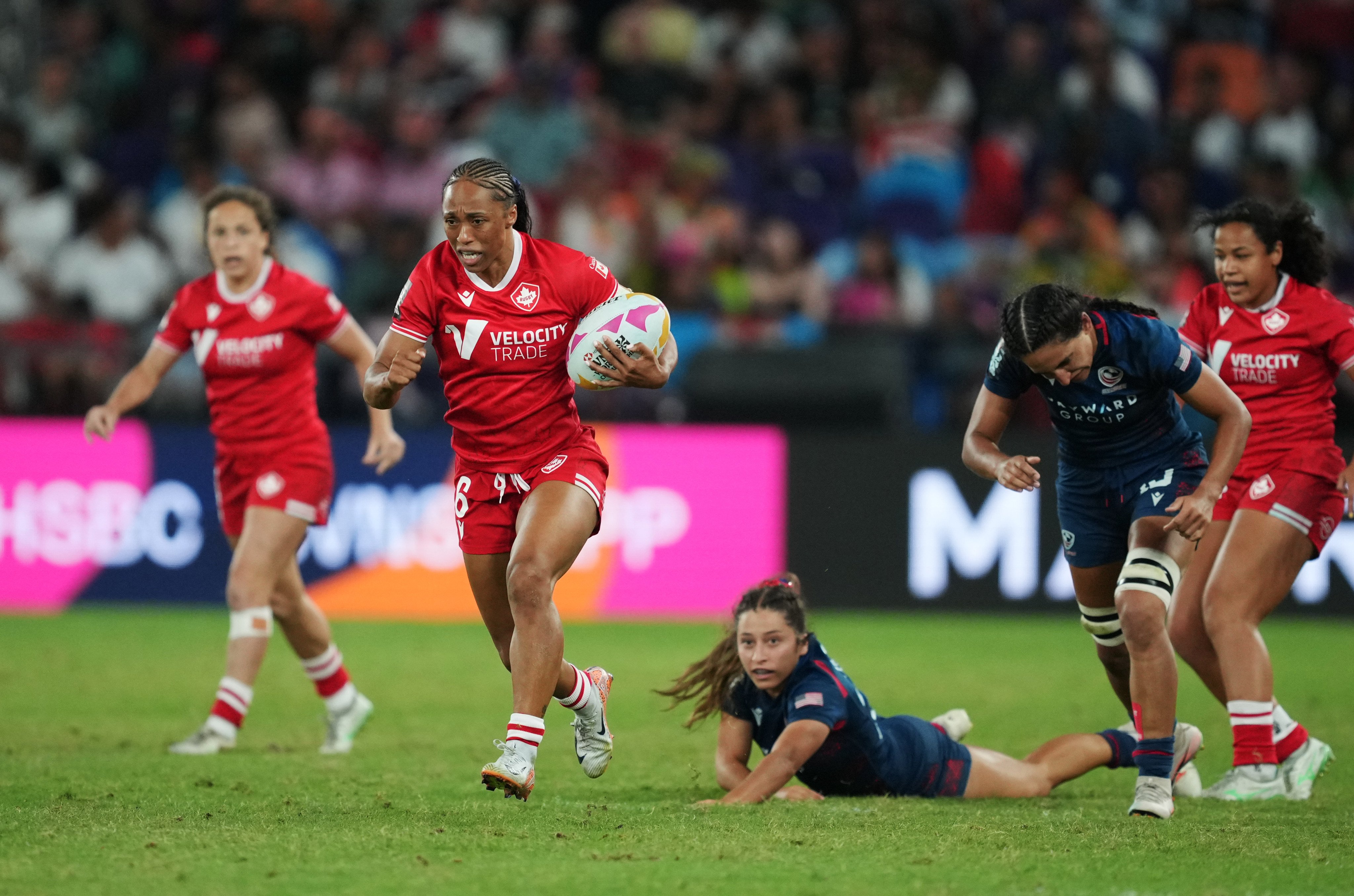 Charity Williams (with ball) scored tow tries as Canada knocked out arch-rivals USA on Saturday. Photo: Sam Tsang