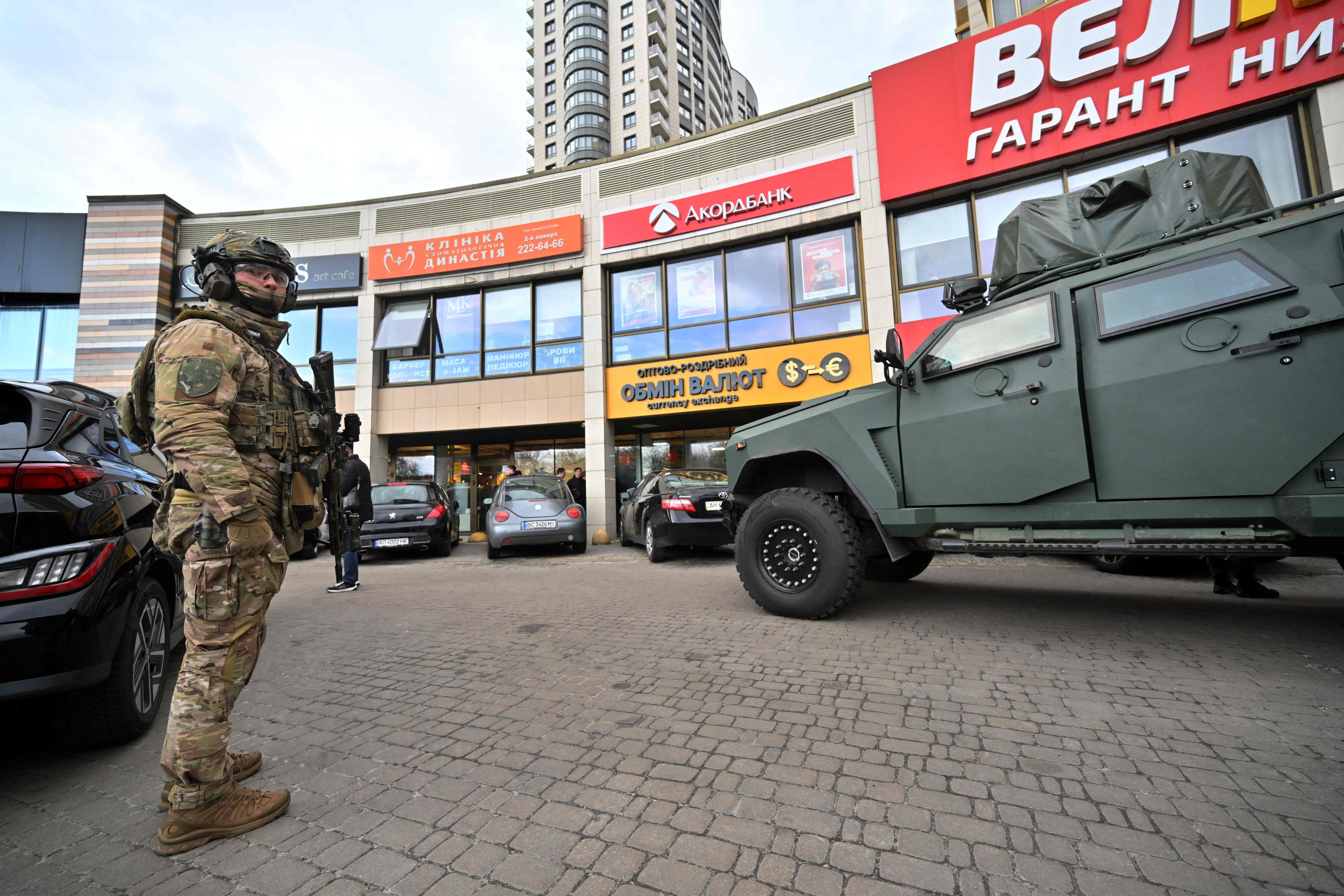 A special team police officer outside a supermarket following a shooting in Kyiv on Saturday. Photo: AFP