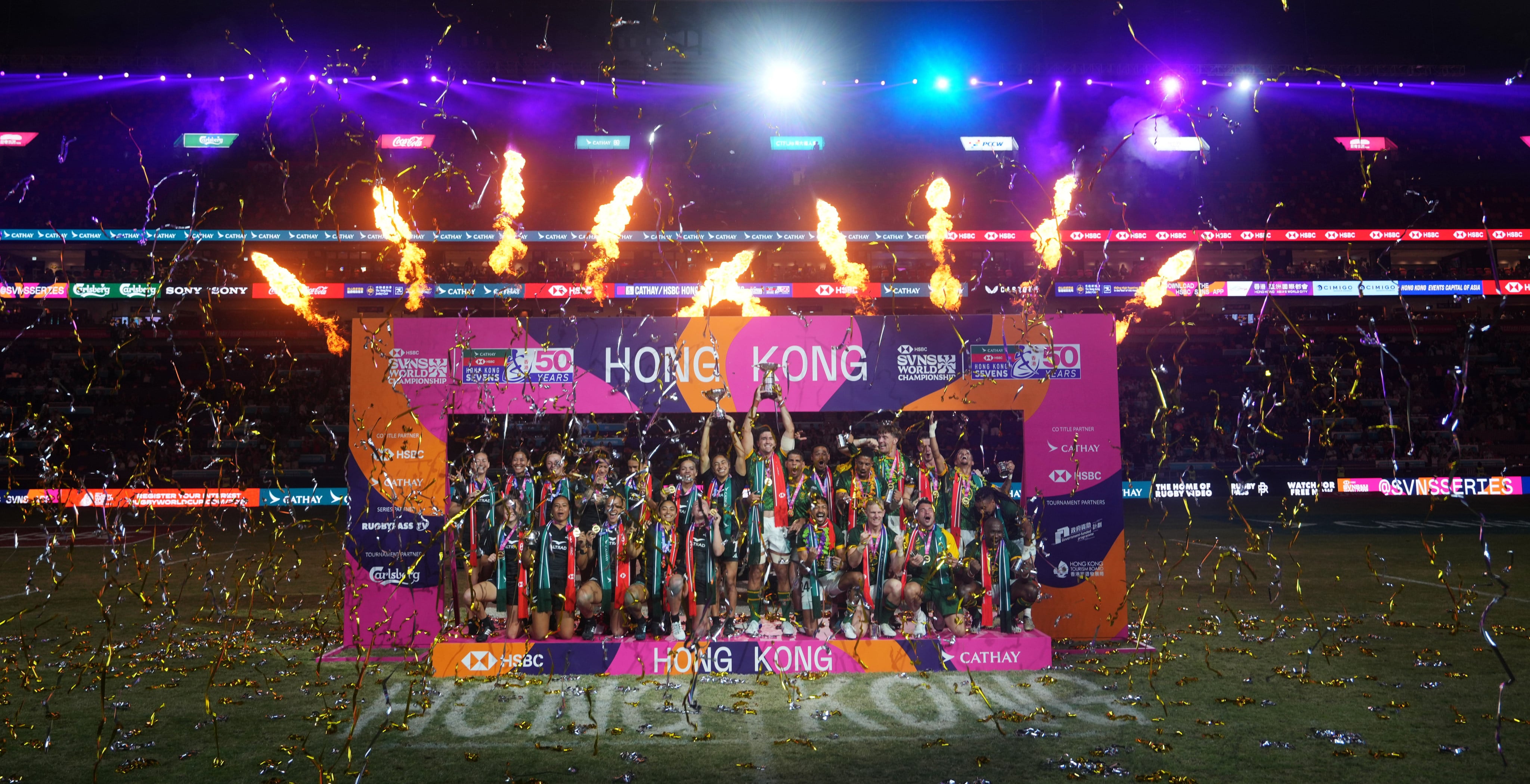 South Africa and New Zealand players celebrate winning the Hong Kong Sevens. Photo: Sam Tsang