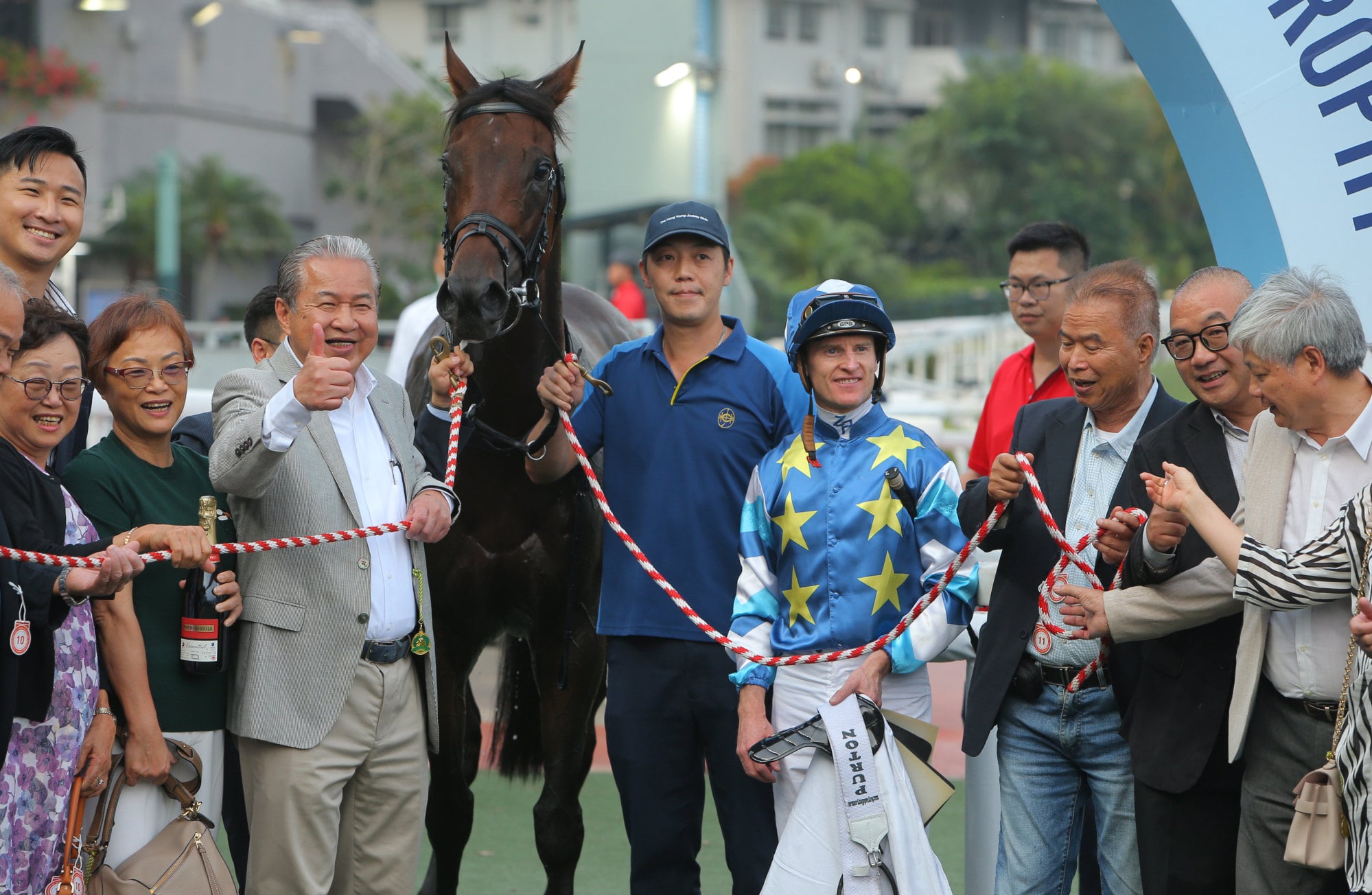 Jockey Zac Purton and connections of Gold Patch celebrate the galloper’s latest win.