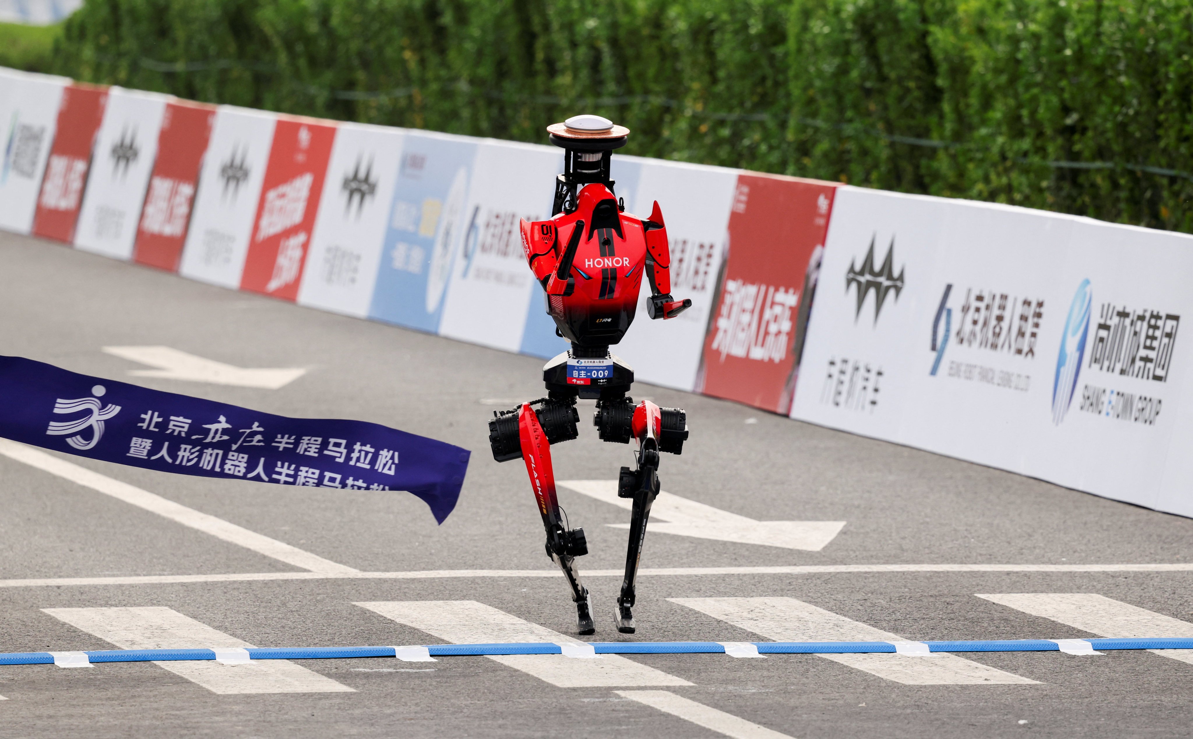 scmp.com - Ben Jiang - Winner of second Beijing robot half-marathon smashes human world record by 6 minutes