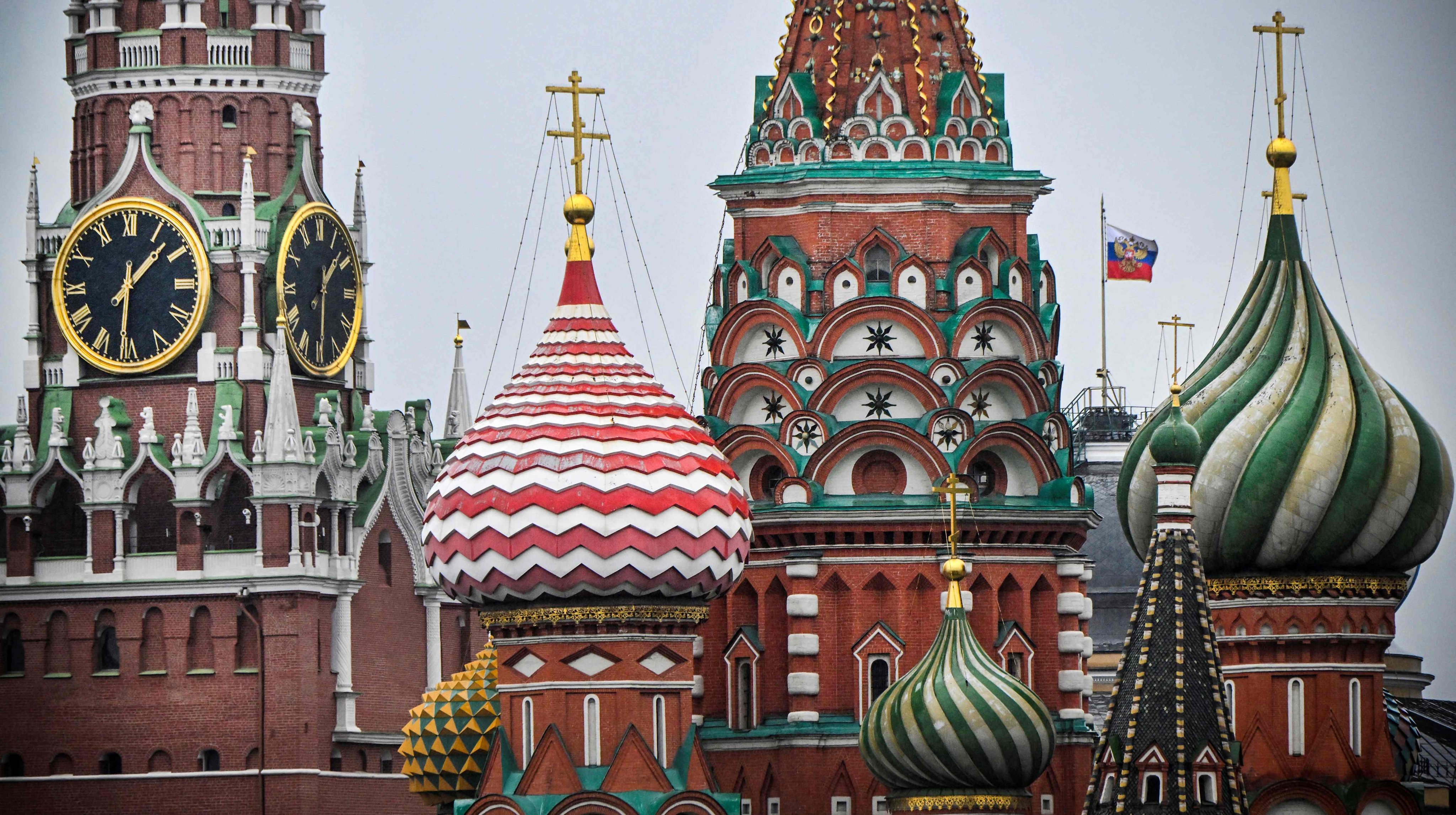 The Kremlin’s Spasskaya tower and St. Basil’s cathedral in downtown Moscow. Russia says it has arrested a German woman over a planned “terrorist attack” linked to Ukraine. Photo: AFP