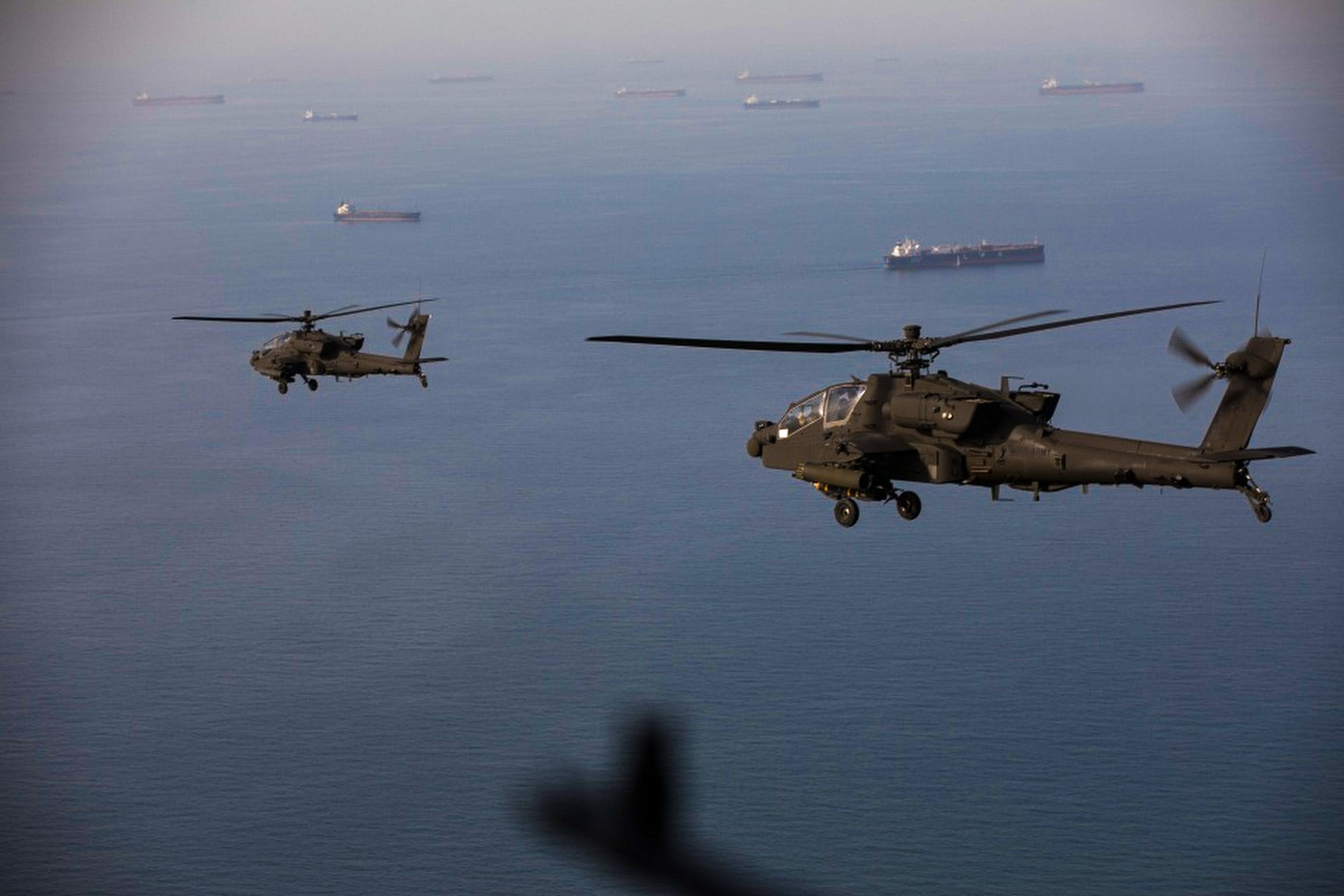 US Army helicopters fly above the Strait of Hormuz during a patrol on Friday. Photo: Handout