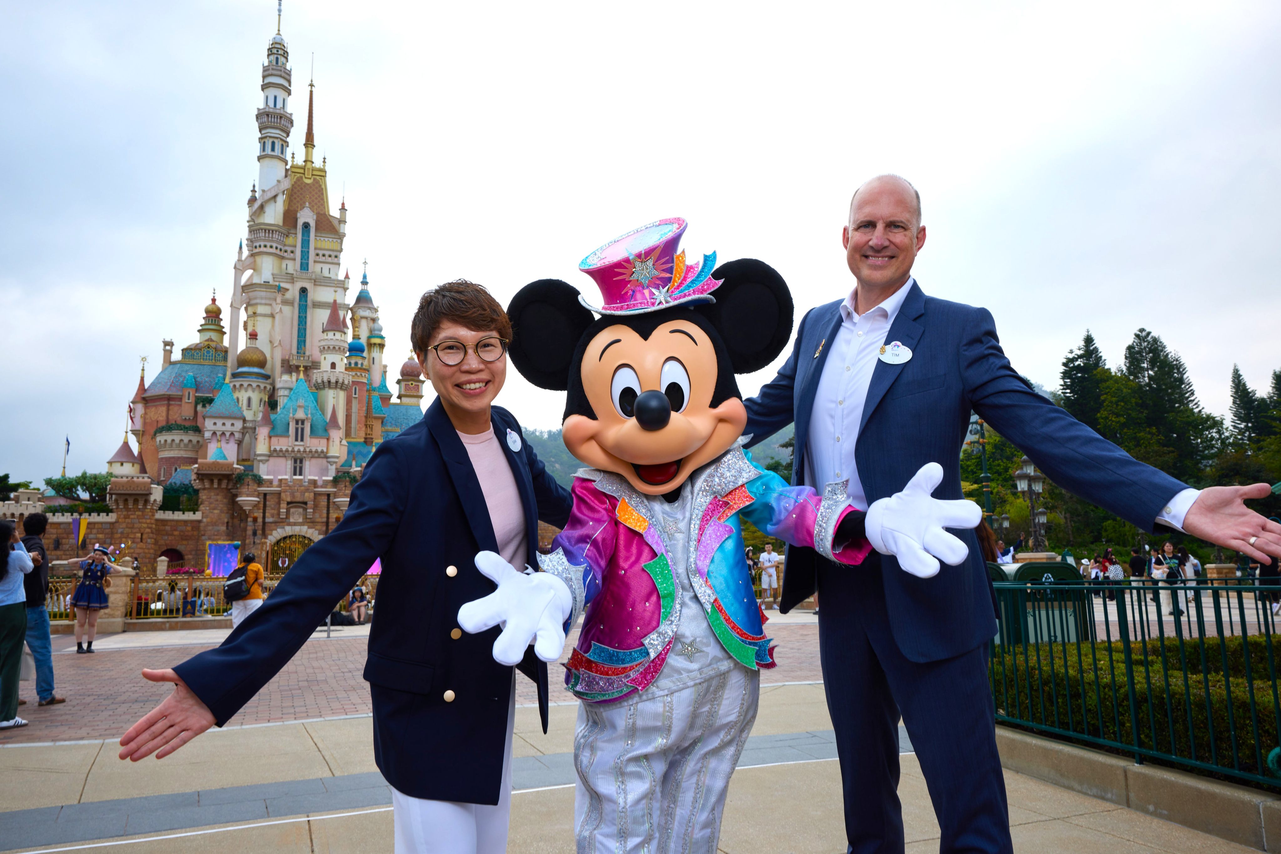 Sam Chan (left), director of marketing, and Tim Sypko, managing director, join Mickey Mouse at Hong Kong Disneyland Resort which is planning expansion projects including Pixar- and Marvel-themed experiences.