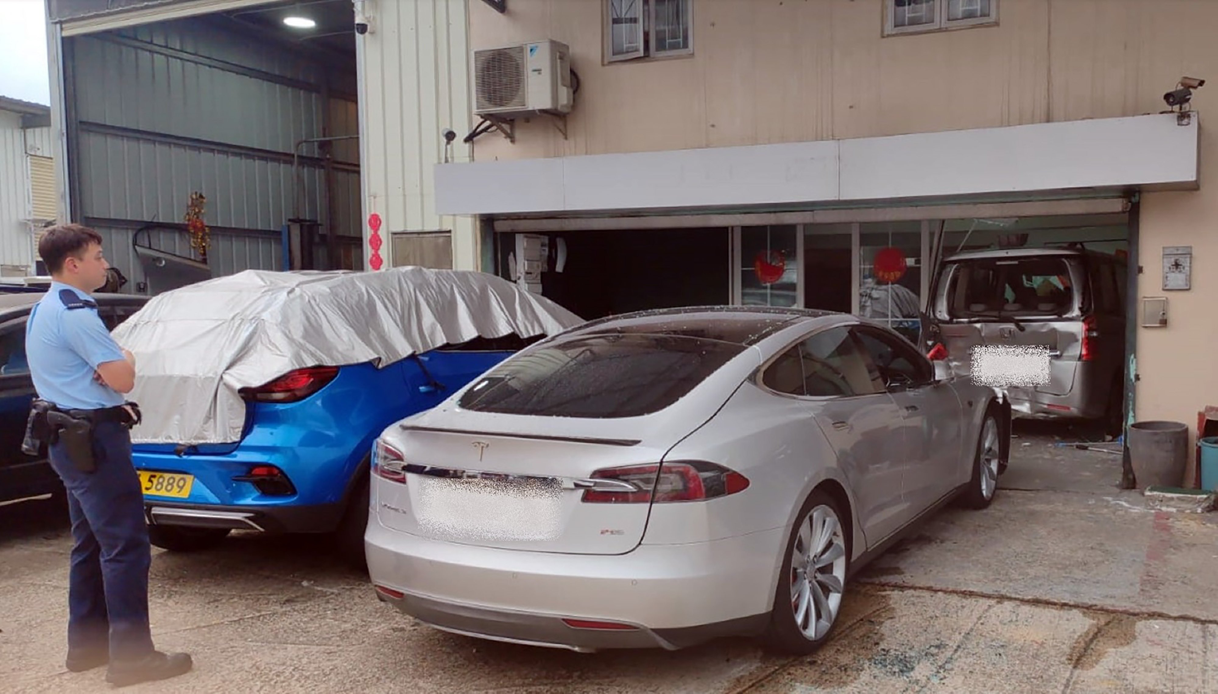 Hong Kong police have arrested a 16-year-old garage worker for driving without a licence. Photo: Handout