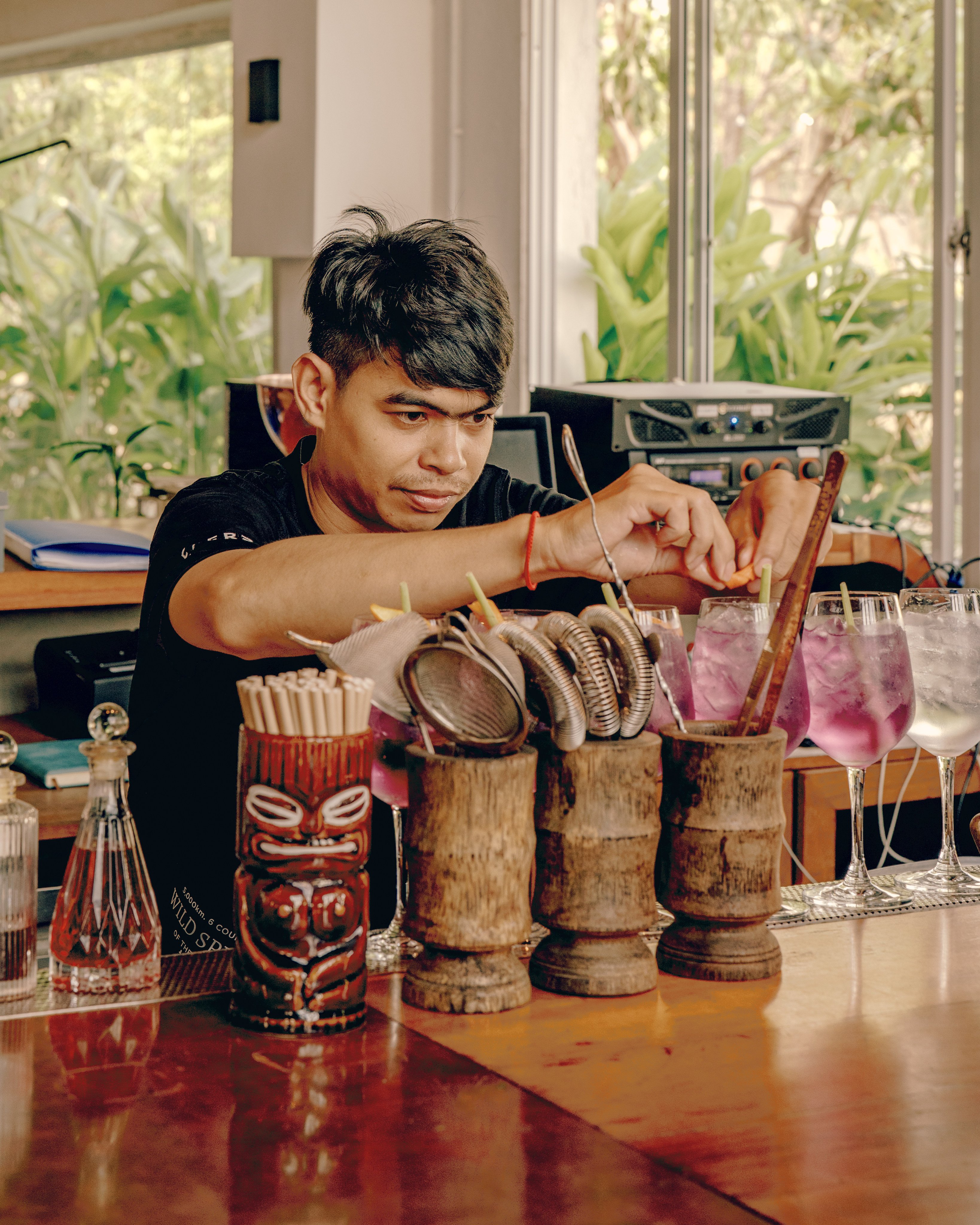 A bartender puts the finishing touches on cocktails served at Seekers Spirits’ distillery and bar in Phnom Penh, Cambodia. Photo: Seekers Spirits