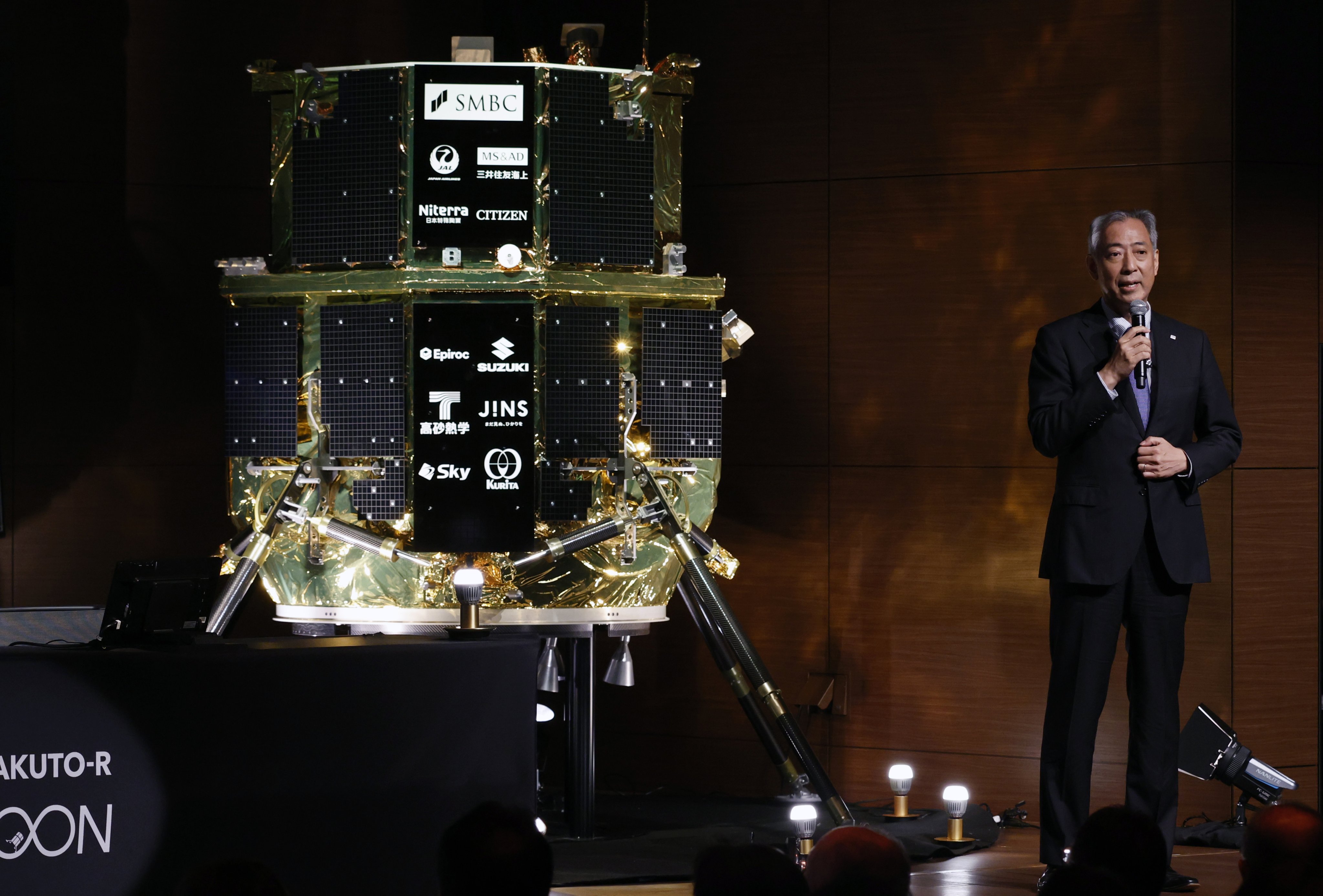 JAXA President Hiroshi Yamakawa speaks next to a replica of Resilience, a moon lander built by Japan-based start-up ispace, on June 6, 2025. Photo: EPA-EFE