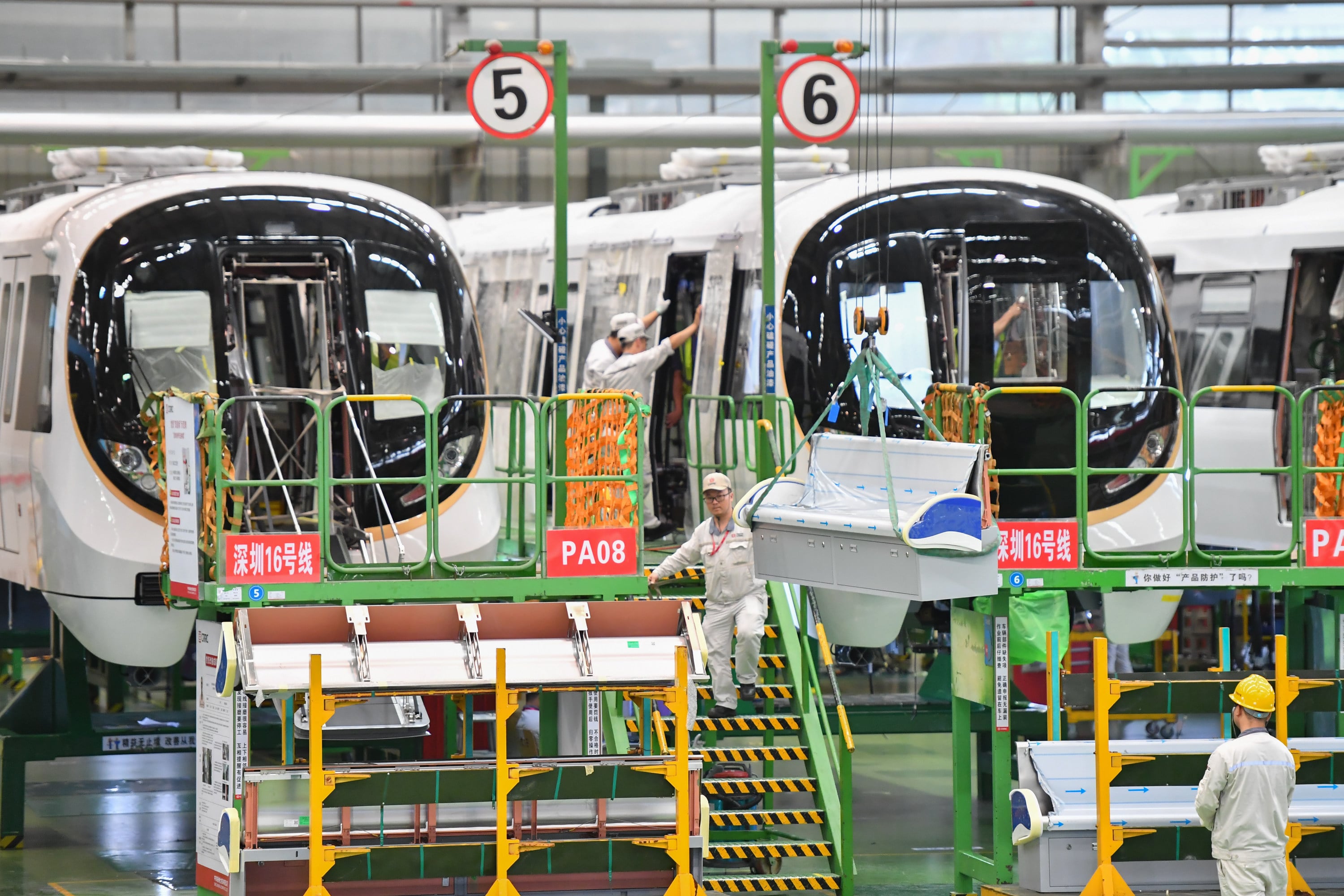 Workers operate on a production line at an assembly workshop of CRRC Zhuzhou Locomotive in China’s Hunan province. Photo: Xinhua