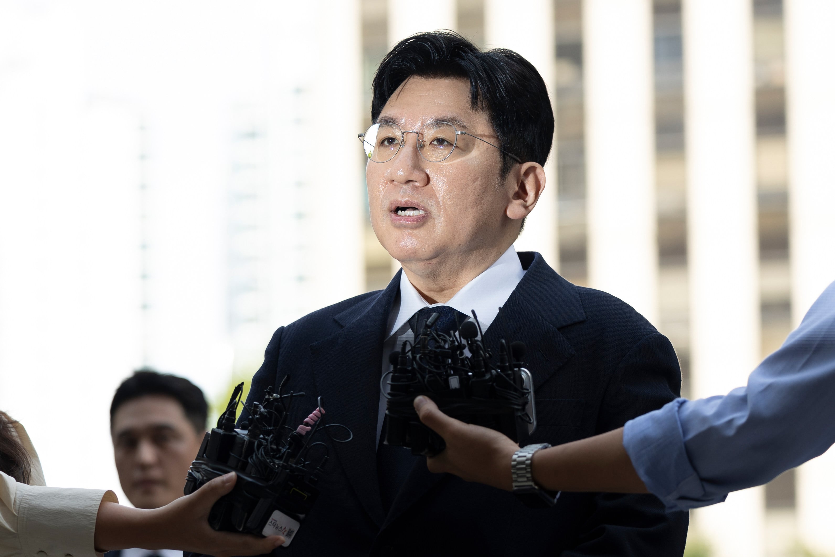 Hybe chairman Bang Si-hyuk answers reporters’ question upon his arrival at the Seoul Metropolitan Police Agency on September 15, 2025. Photo: Newsis/AP