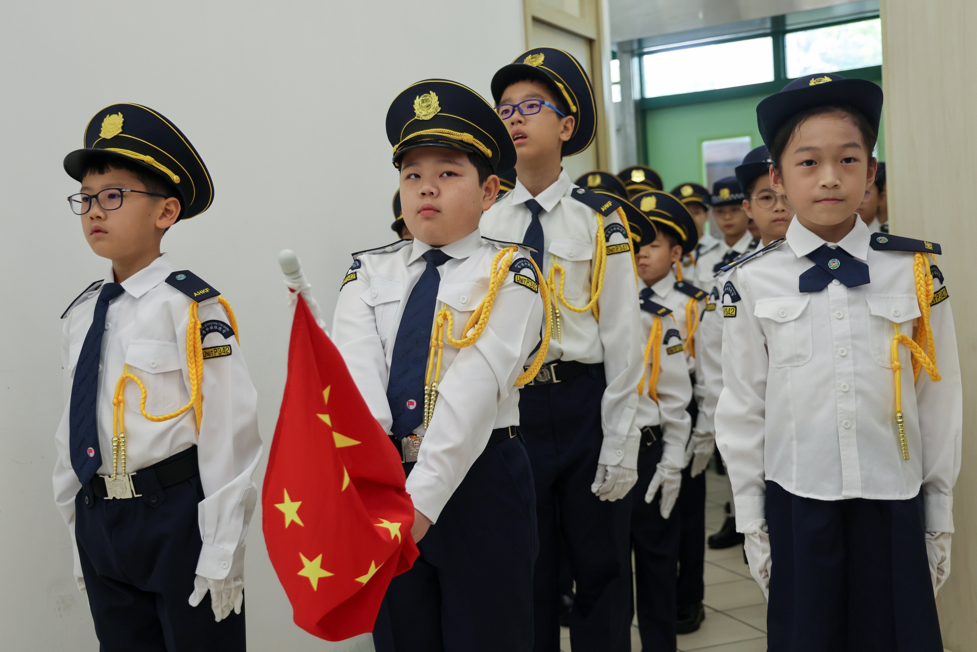 Students of Tai Po Old Market Public School hold a flag-raising ceremony on the first day of school on September 1, 2025. Photo: Jelly Tse