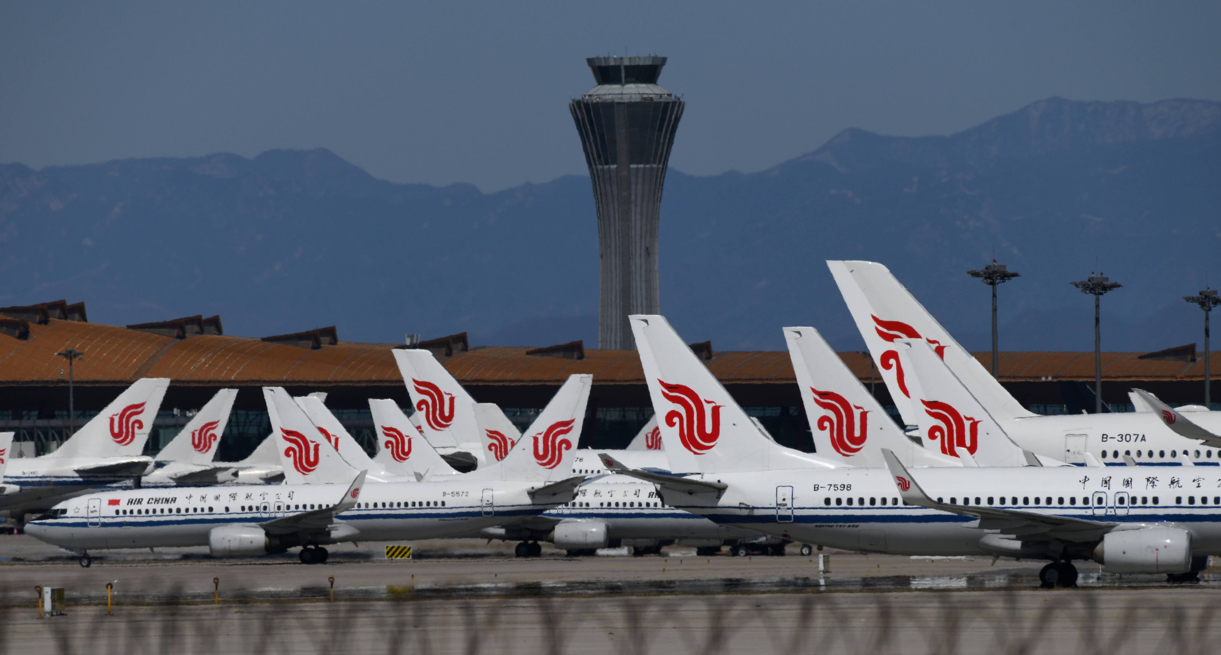 Air China planes are seen parked on the tarmac at an airport in Beijing in 2020. Photo: AFP