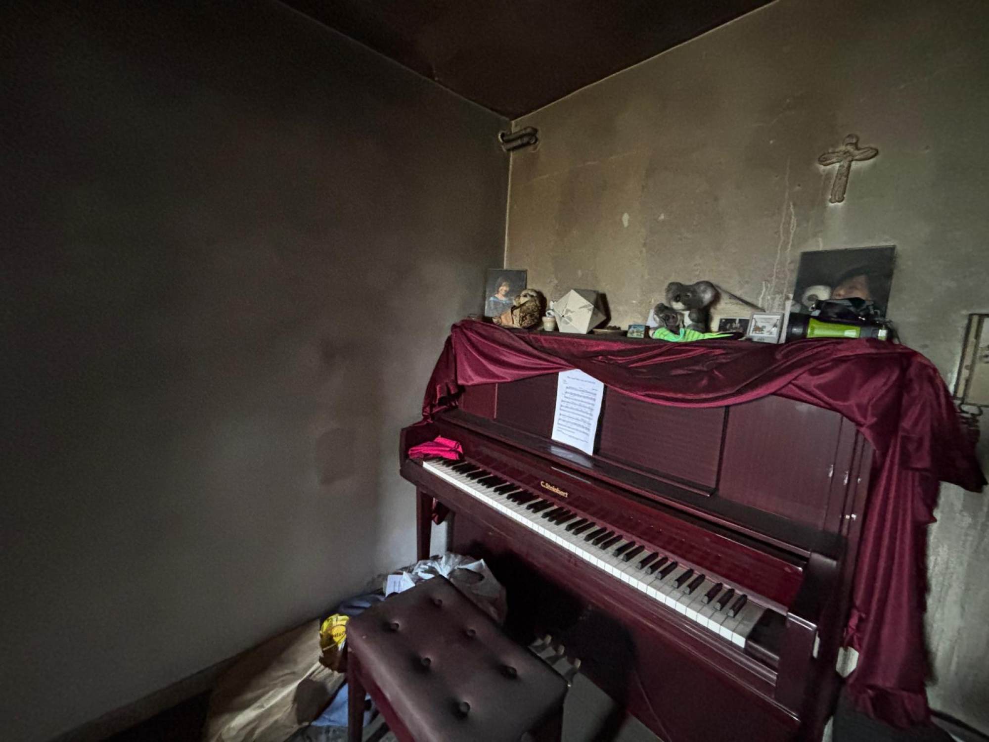 Mandy Wong’s flat on the 25th floor has blackened walls, but her piano remains intact. Photo: Handout