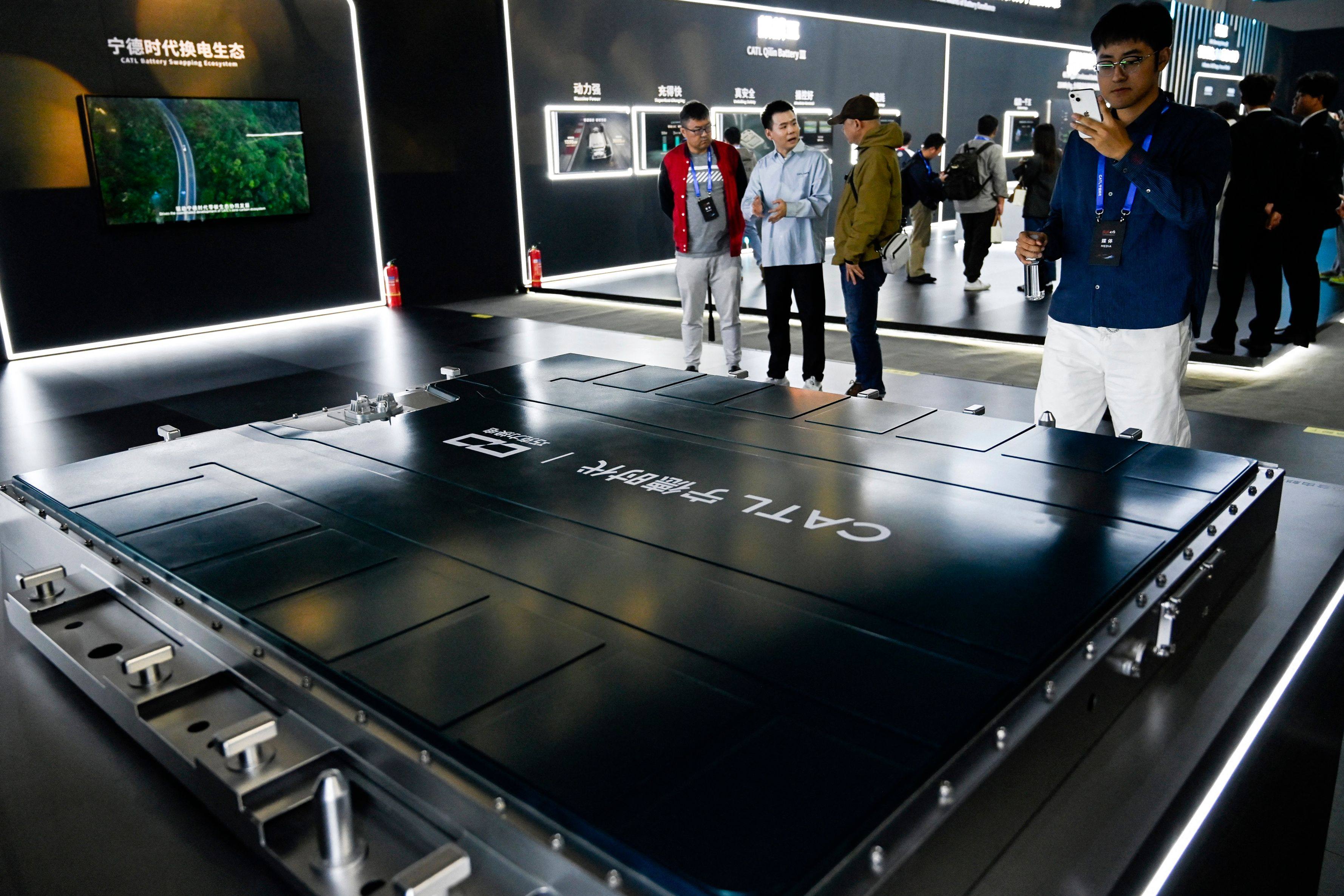 People look at a model of CATL’s Chocolate 26# Battery during the CATL Tech Day event ahead of the Beijing Auto Show in Beijing on April 21. Photo: AFP