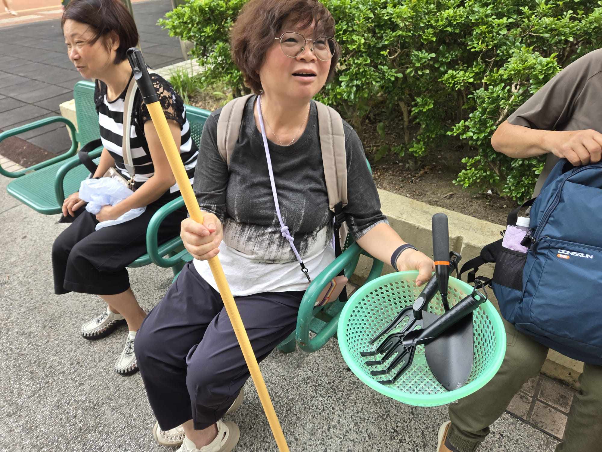 Mrs Tam shows some of the improvised tools her husband is using to search their flat. Photo: Jess Ma