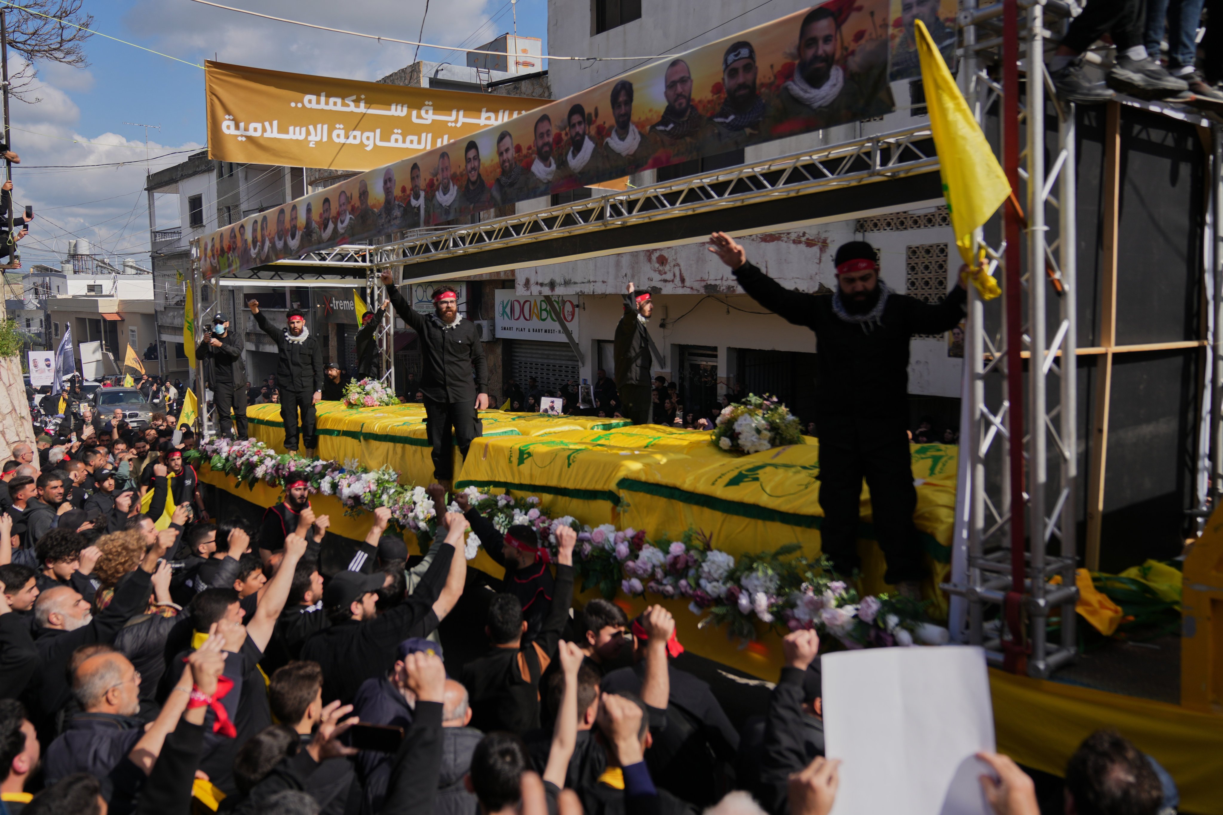 Coffins of Hezbollah fighters killed before the ceasefire, during a mass funeral procession on Tuesday in the southern village of Kfar Sir, Lebanon. Photo: AP