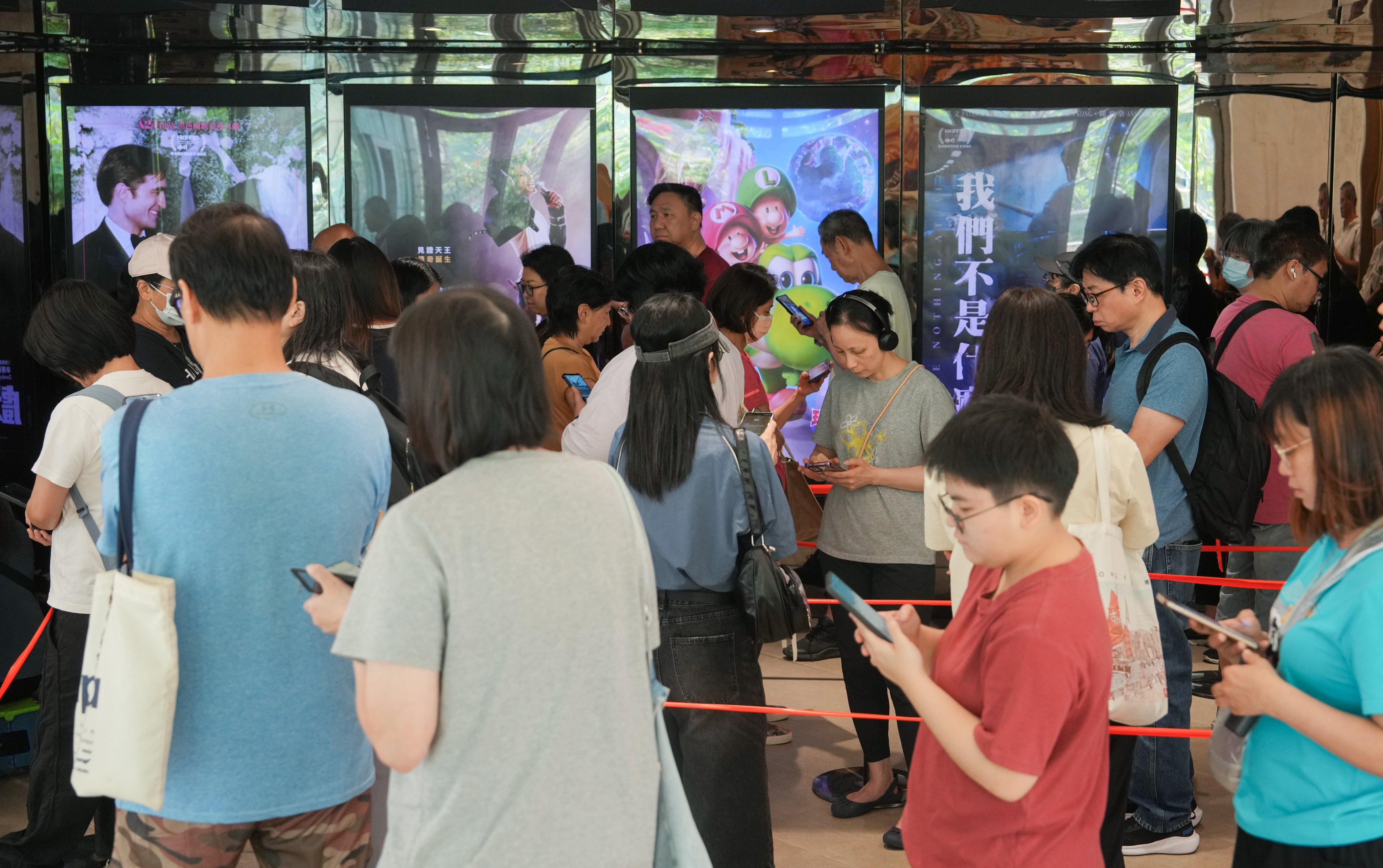 Customers queue at Star Cinema in Tseung Kwan O to buy HK$30 tickets on Wednesday. Photo: Sam Tsang