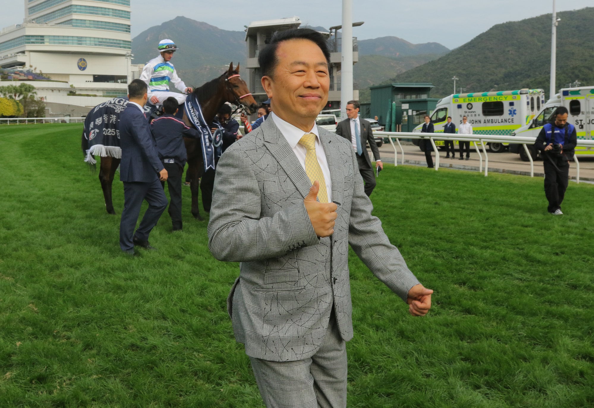 Ricky Yiu Poon-fai celebrates the win of Voyage Bubble in the Group One Hong Kong Mile.