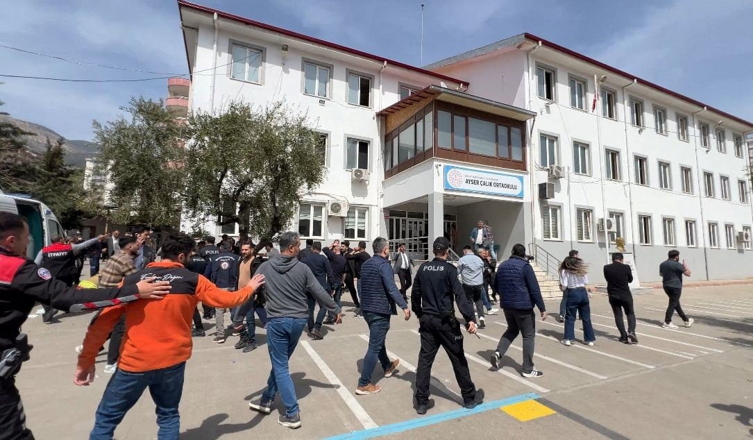 Police officers in uniform and plainclothes police secure the site after a deadly school shooting, in the southeastern province of Kahramanmaras, Turkey, on April 15, 2026. Photo: via Reuters