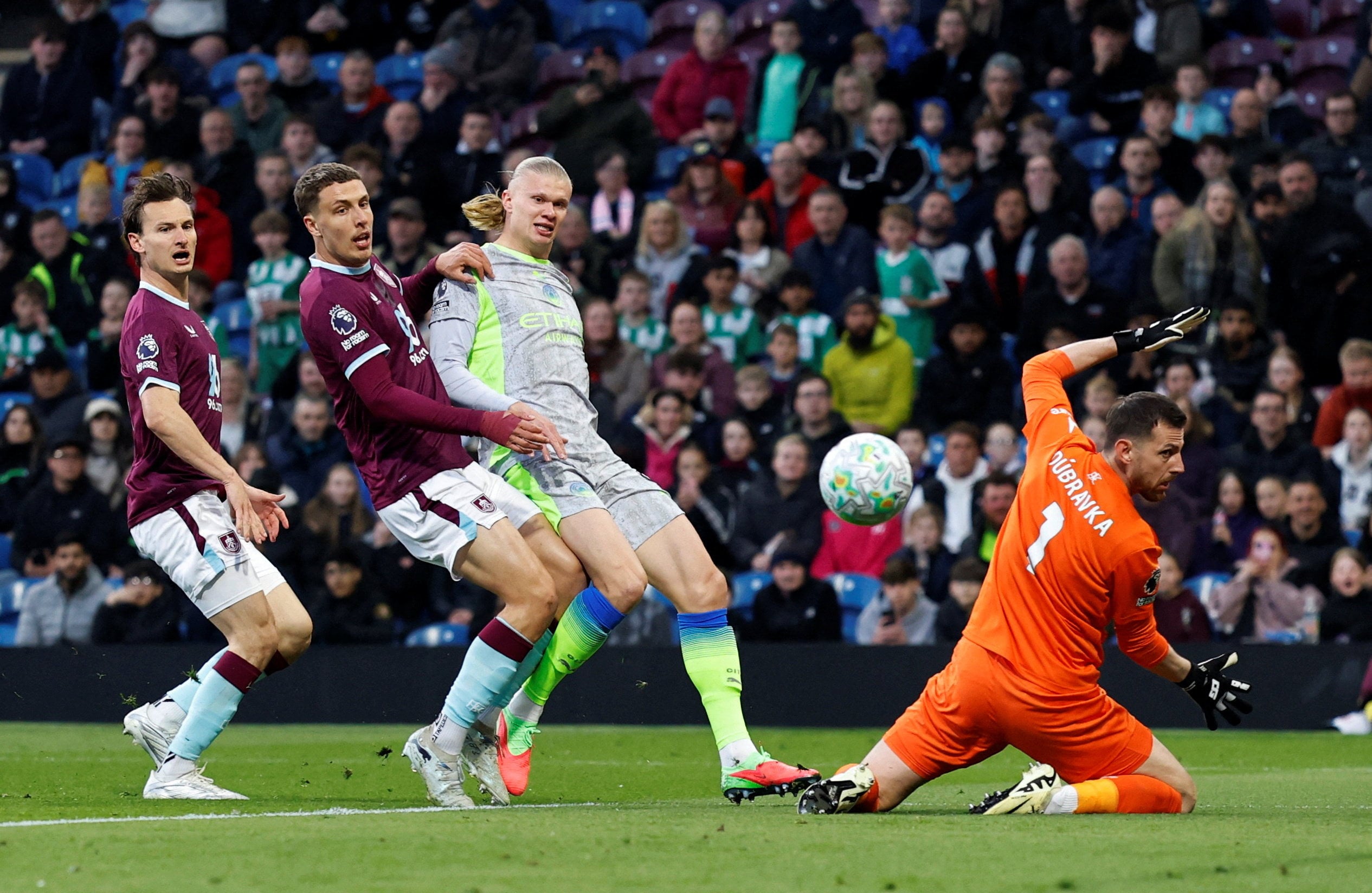 Erling Haaland (middle) scores Manchester City’s goal in their 1-0 win over Burnley on Wednesday to take them to the top of the table. Photo: Reuters