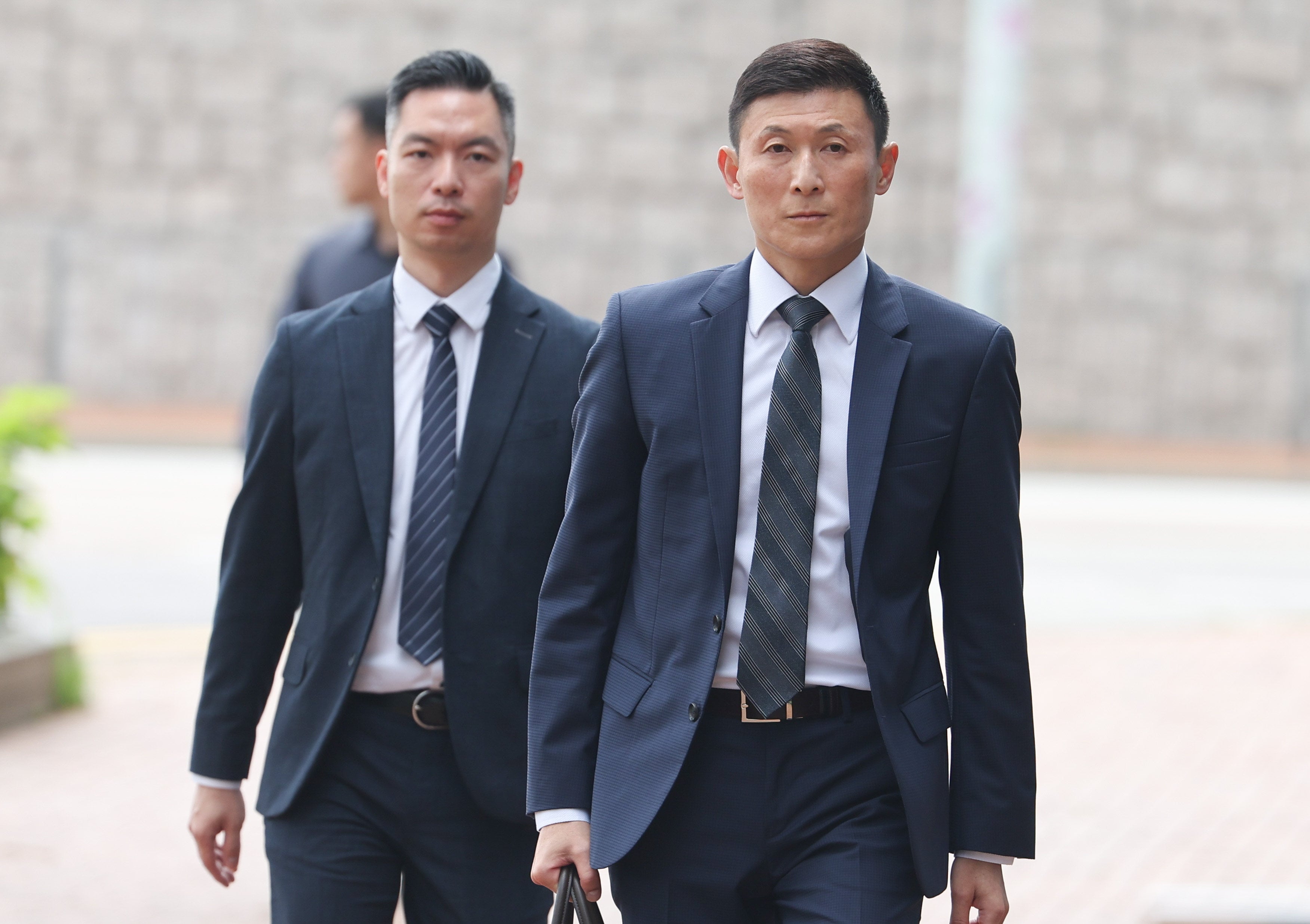 Derek Chan (right) arrives at City Gallery in Central for the hearing. Photo: Edmond So