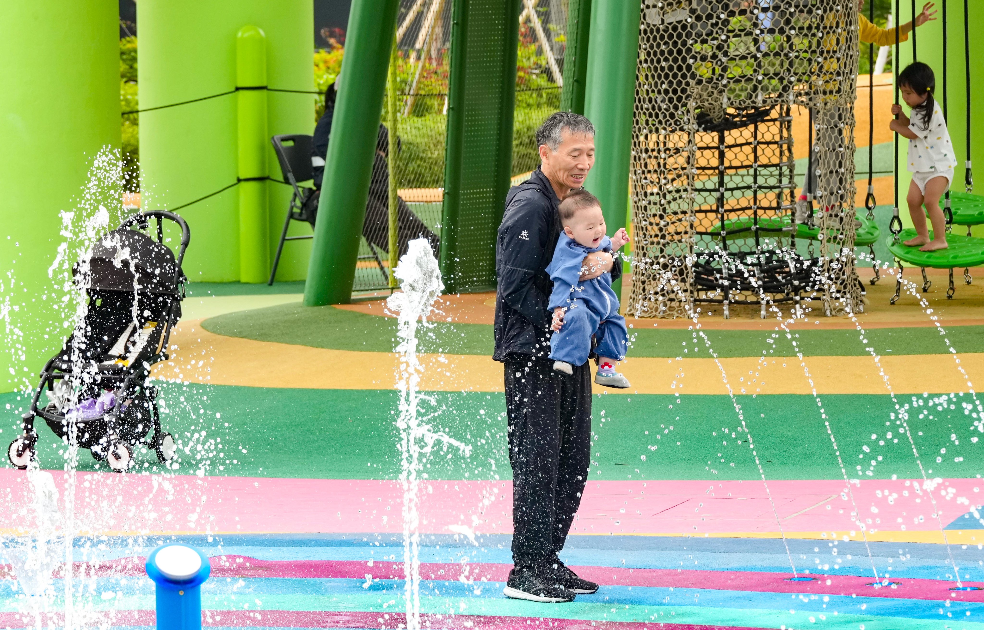 Children and their carers spend time at a playground in Kai Tak Sports Park on February 23. Photo: Jelly Tse