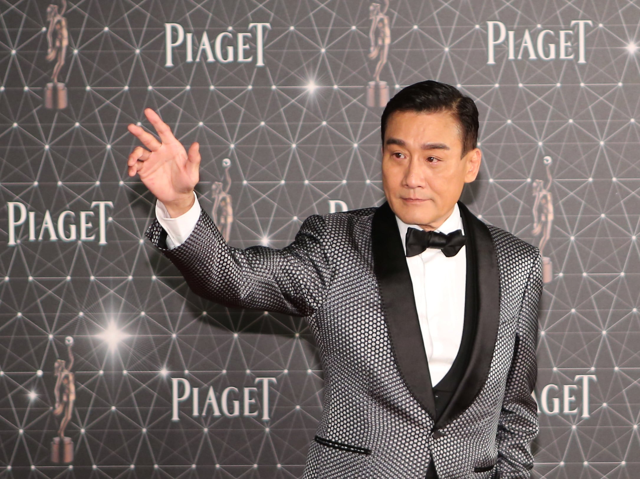 Tony Leung Ka-fai poses on the red carpet during the 35th Hong Kong Film Awards in 2016. His fifth best actor win at the HKFA cements his legendary Hong Kong cinema status. Photo: SCMP