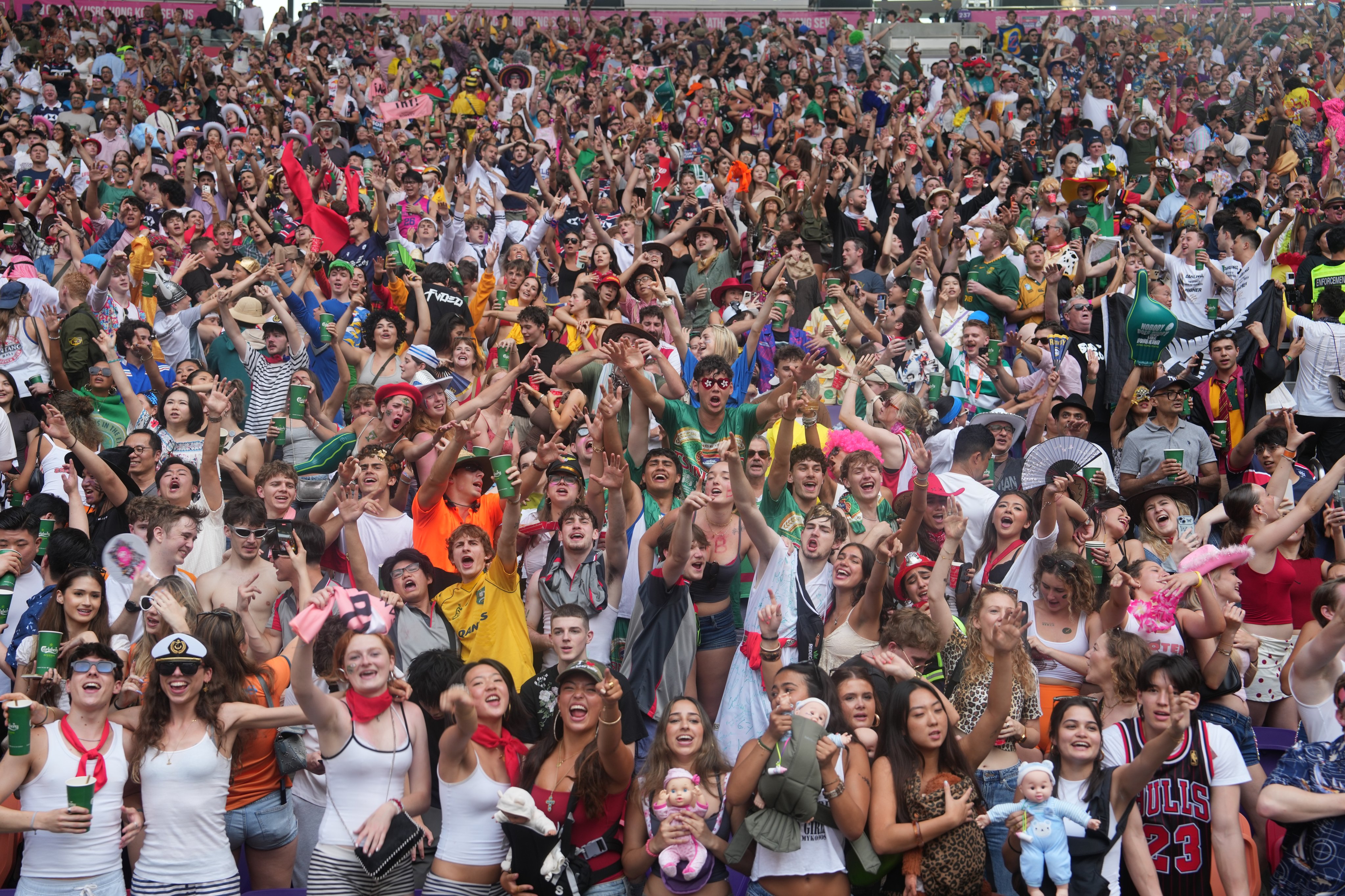 Rugby fans in the south stand celebrate on Day 3 of the Hong Kong Rugby Sevens at Kai Tak Stadium on April 19. Photo: Sam Tsang
