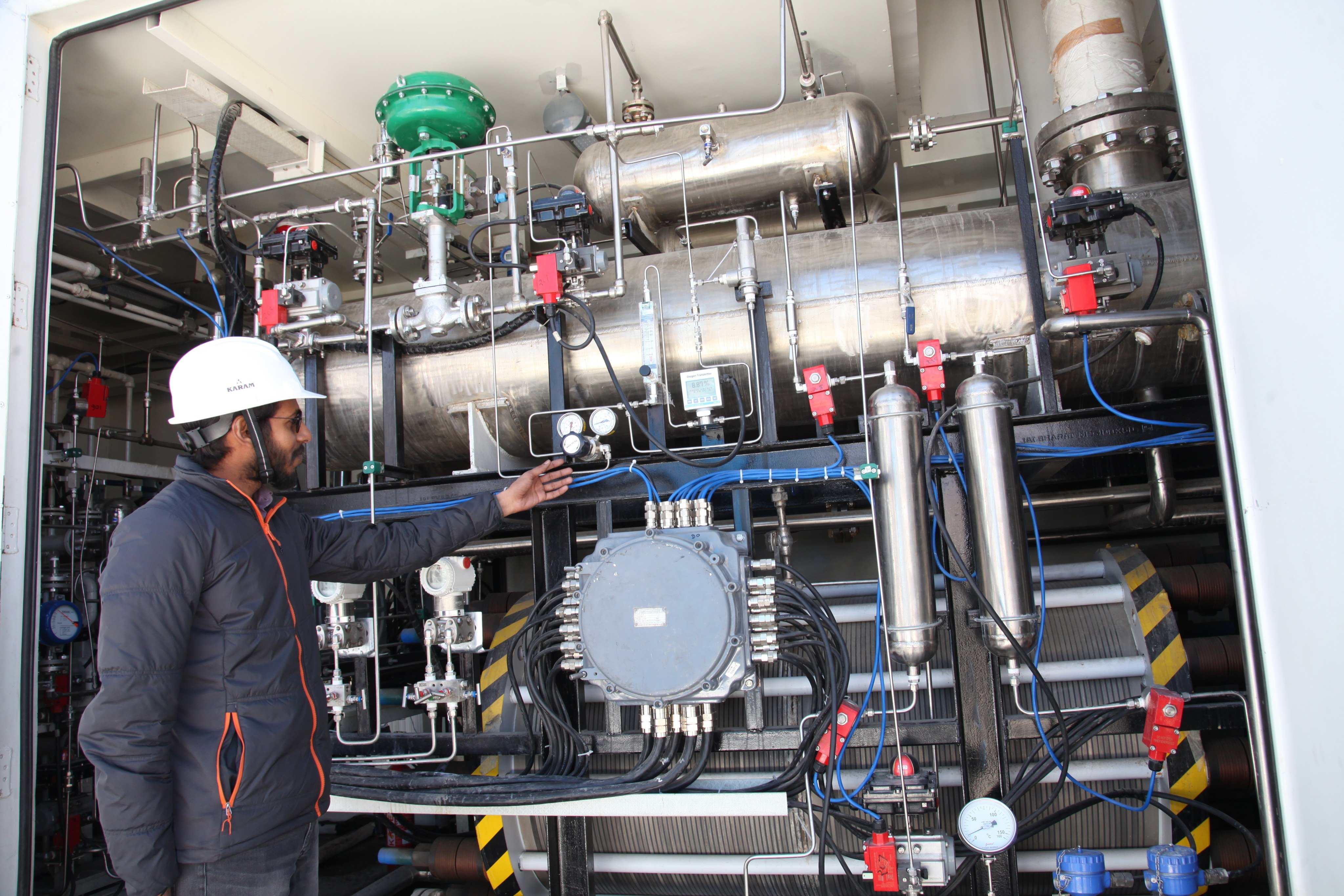 A worker highlights the workings of a green hydrogen demonstration plant in Ladakh, India, on October 11, 2024. Photo: Getty Images