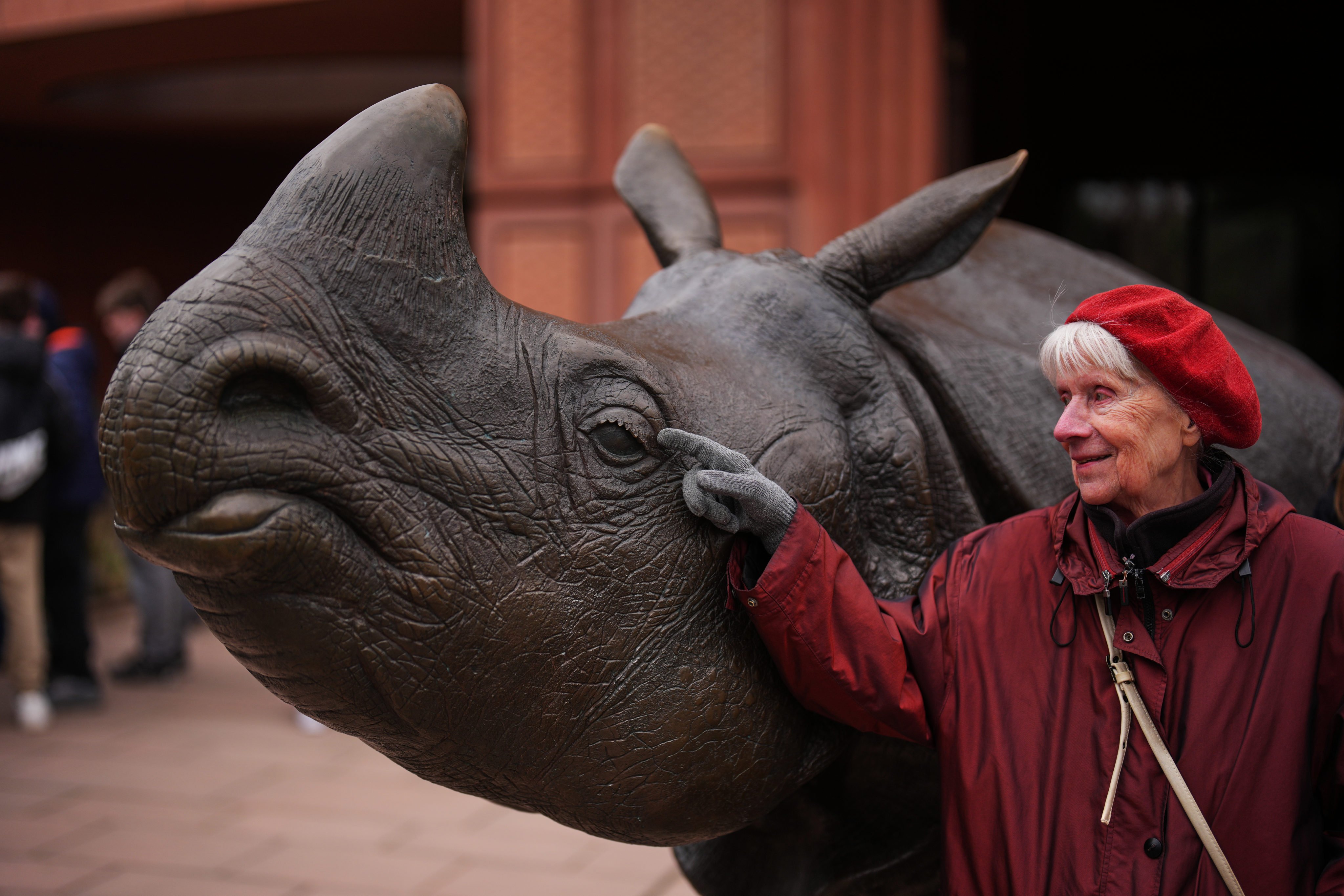 Monika Jansen, 85, touches a sculpture of a rhino as she takes part in a guided tour for people with dementia organised by Malteser Berlin, part of the international Catholic aid organisation The Sovereign Order of Malta, at Berlin Zoo in Germany on March 26, 2026. Photo: AP