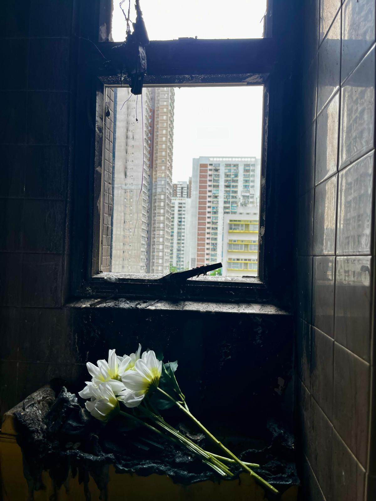 Residents made an emotional return to their fire-ravaged flats at Wang Fuk Court to salvage belongings. Photo: Handout
